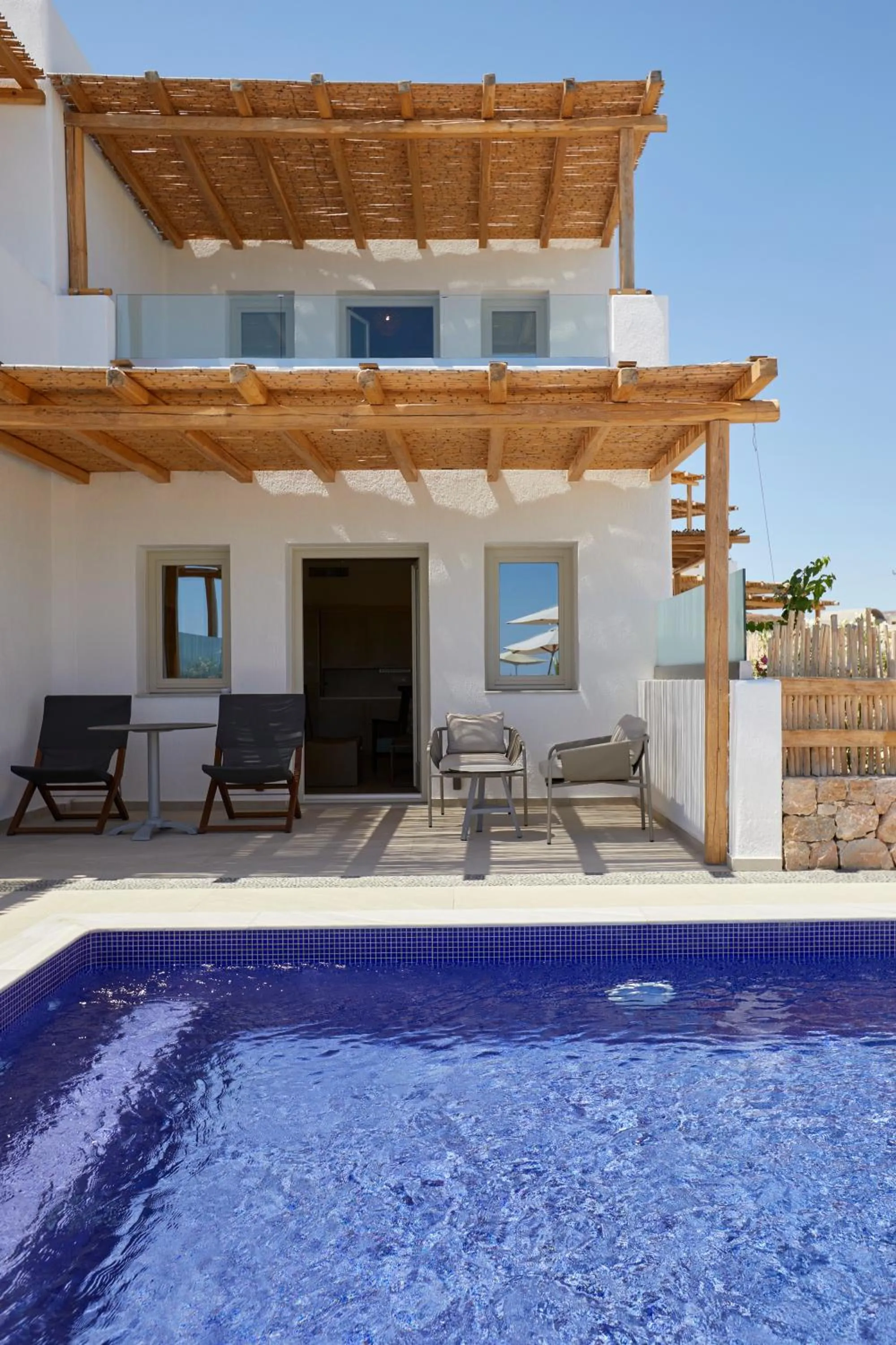 Photo of the whole room in Sea Breeze Santorini Beach Resort, Curio By Hilton