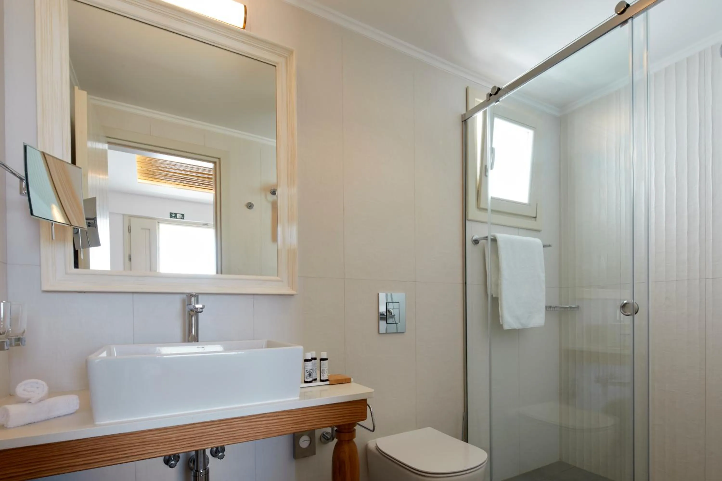 Shower in Sea Breeze Santorini Beach Resort, Curio By Hilton