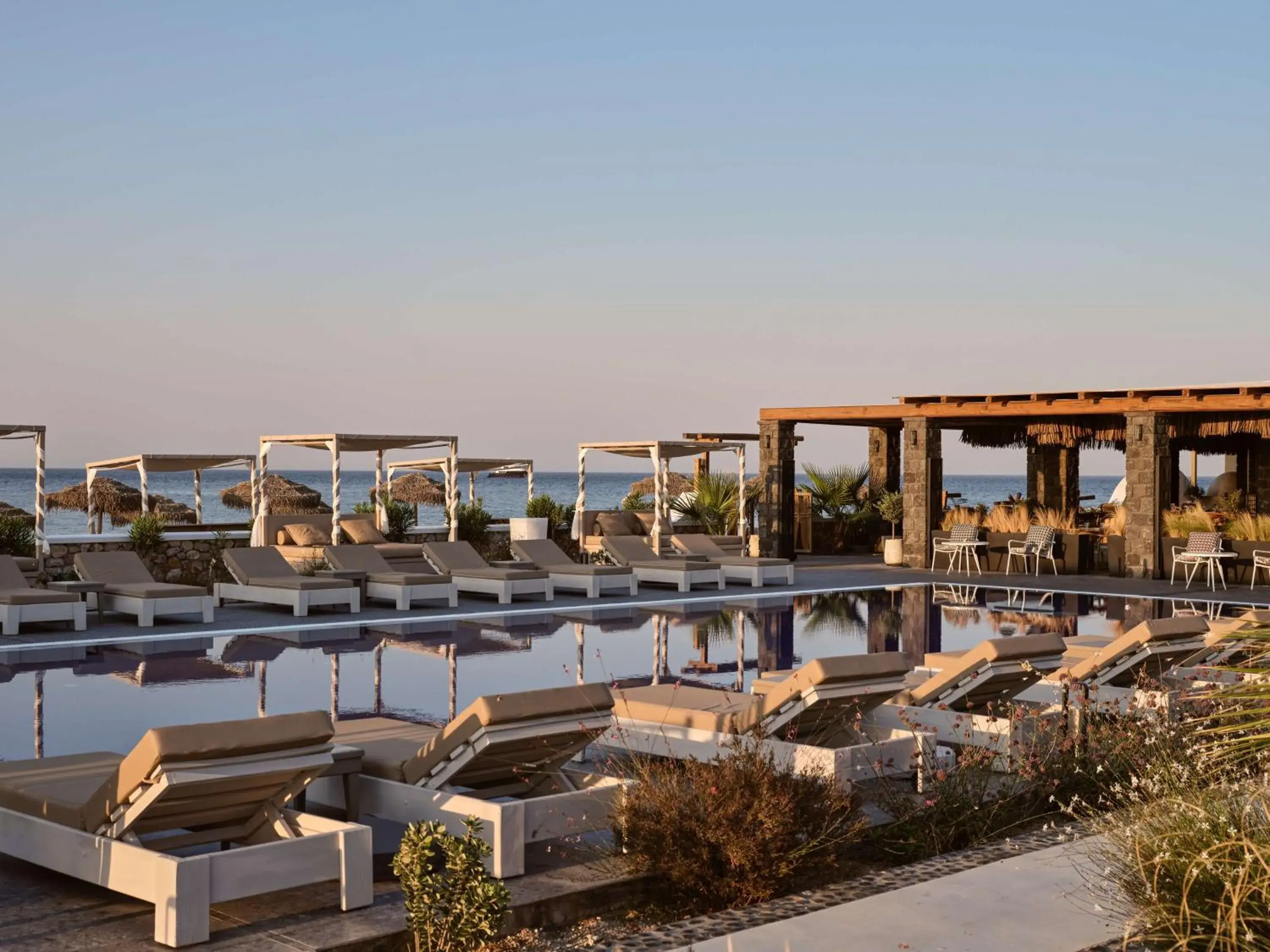 Pool view in Sea Breeze Santorini Beach Resort, Curio By Hilton Pool view in Sea Breeze Santorini Beach Resort, Curio By Hilton