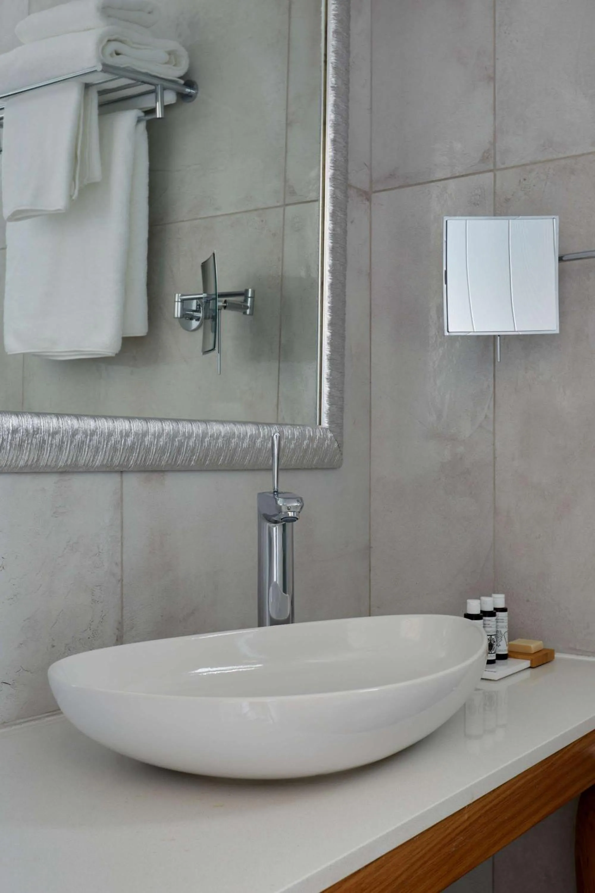 Bathroom in Sea Breeze Santorini Beach Resort, Curio By Hilton