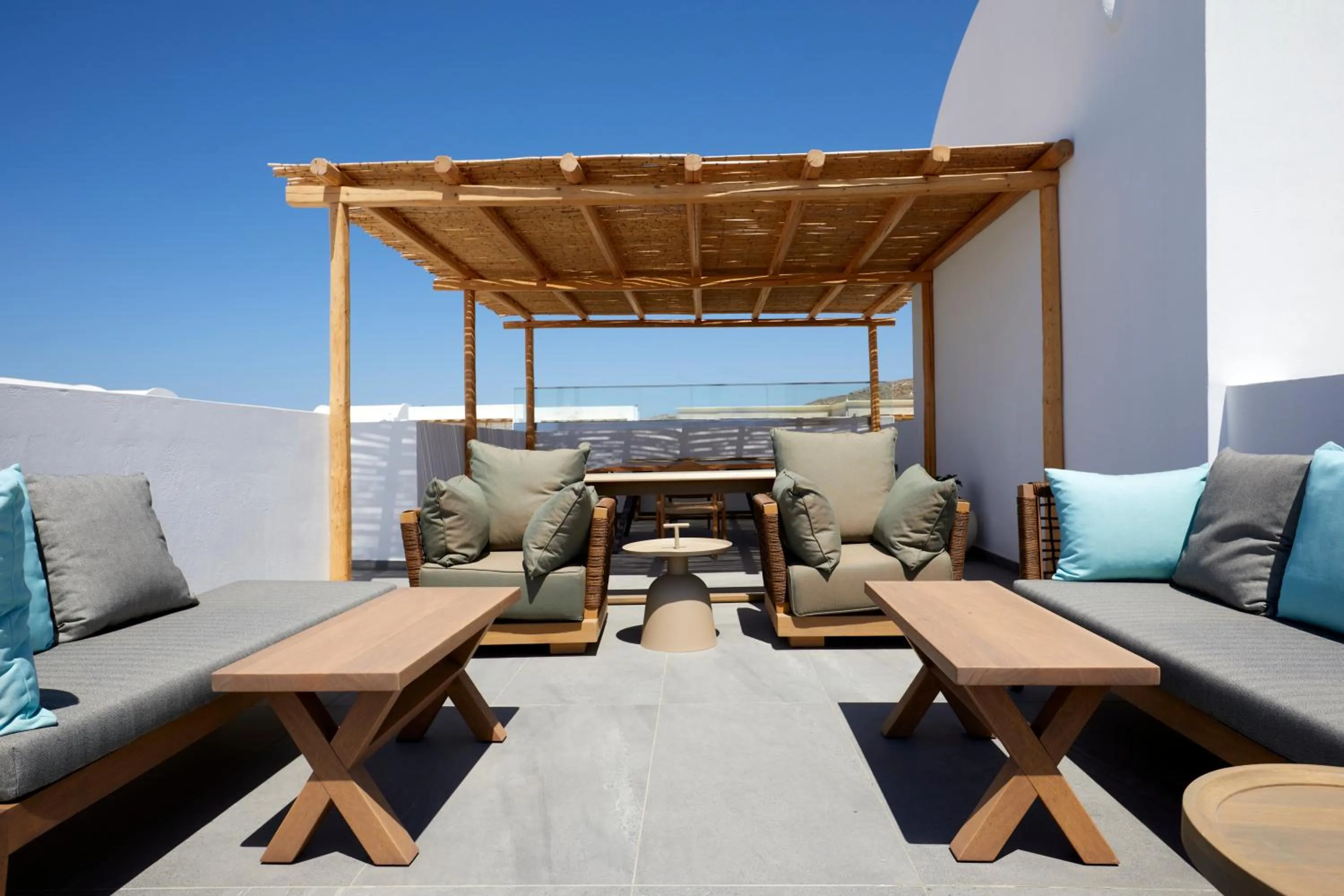 Patio in Sea Breeze Santorini Beach Resort, Curio By Hilton