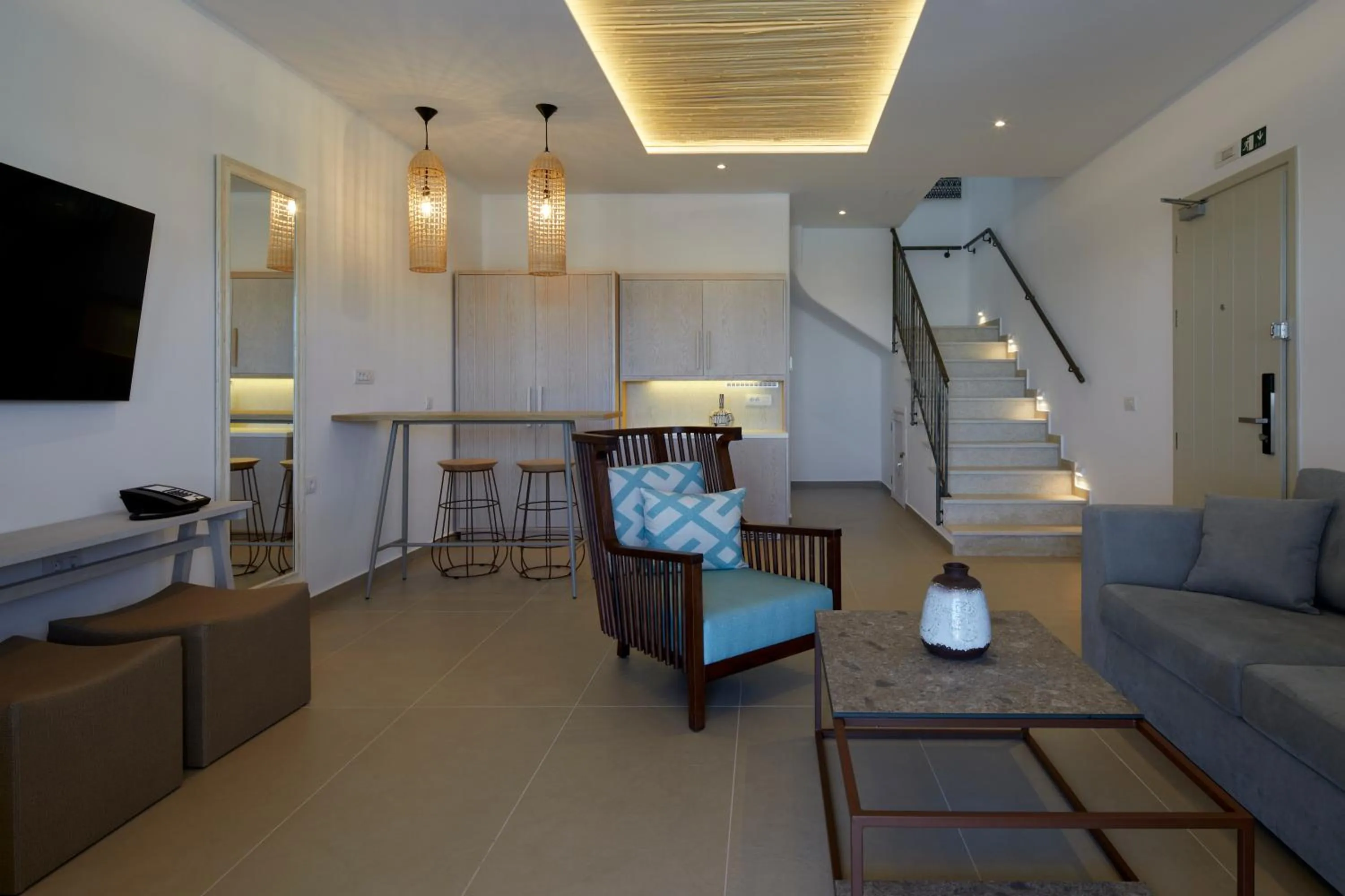 Living room in Sea Breeze Santorini Beach Resort, Curio By Hilton