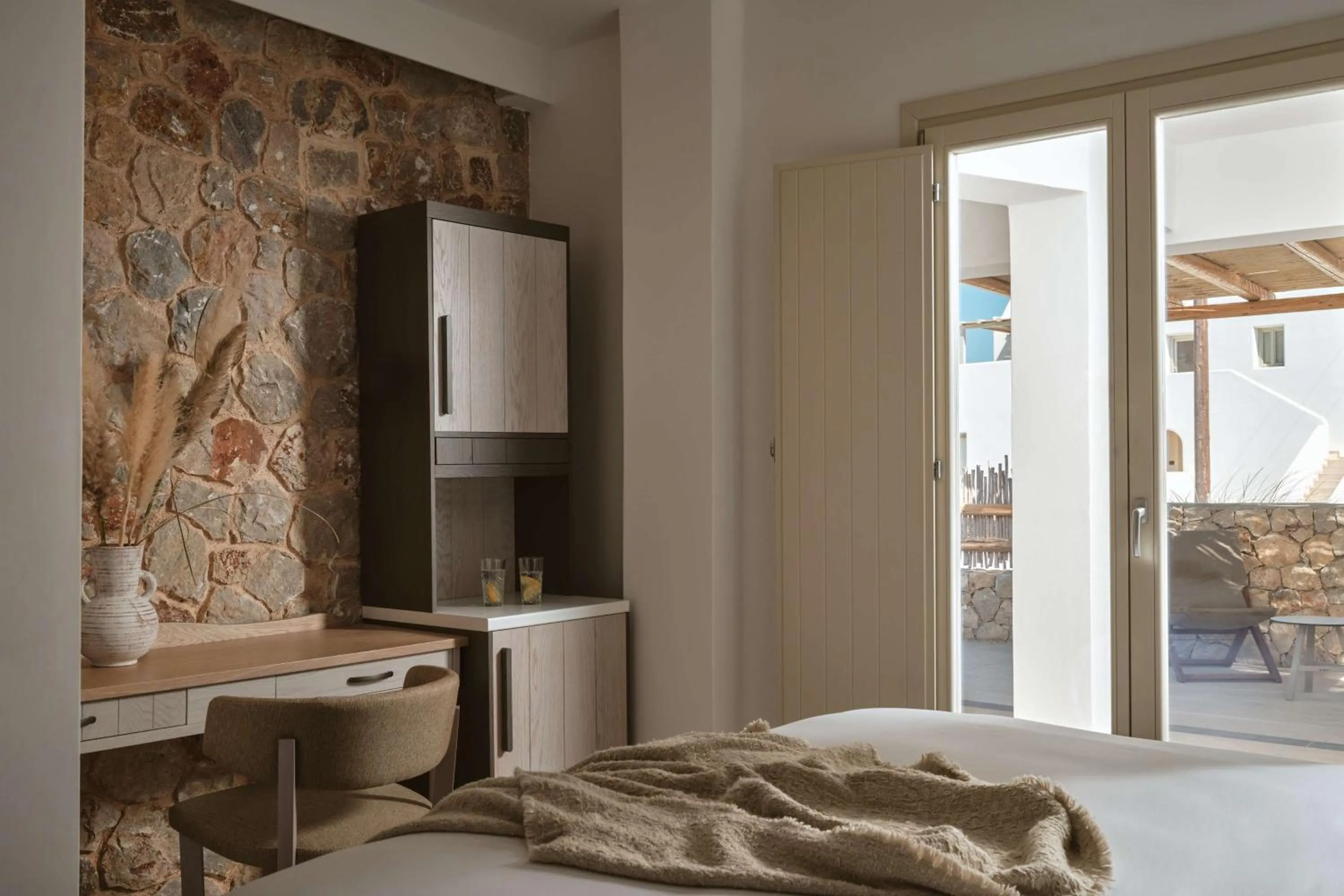 Bed in Sea Breeze Santorini Beach Resort, Curio By Hilton