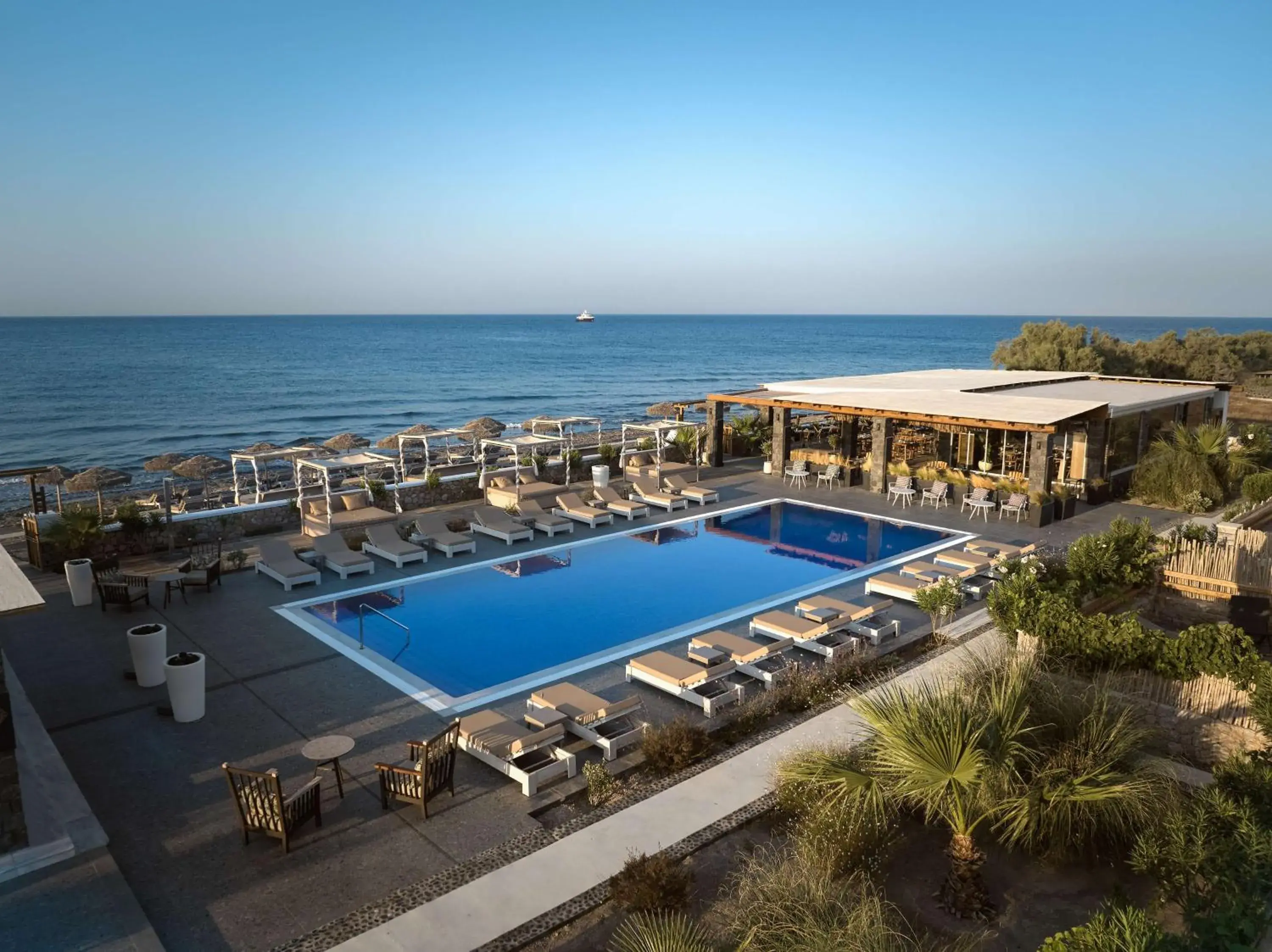 Pool view in Sea Breeze Santorini Beach Resort, Curio By Hilton Pool view in Sea Breeze Santorini Beach Resort, Curio By Hilton