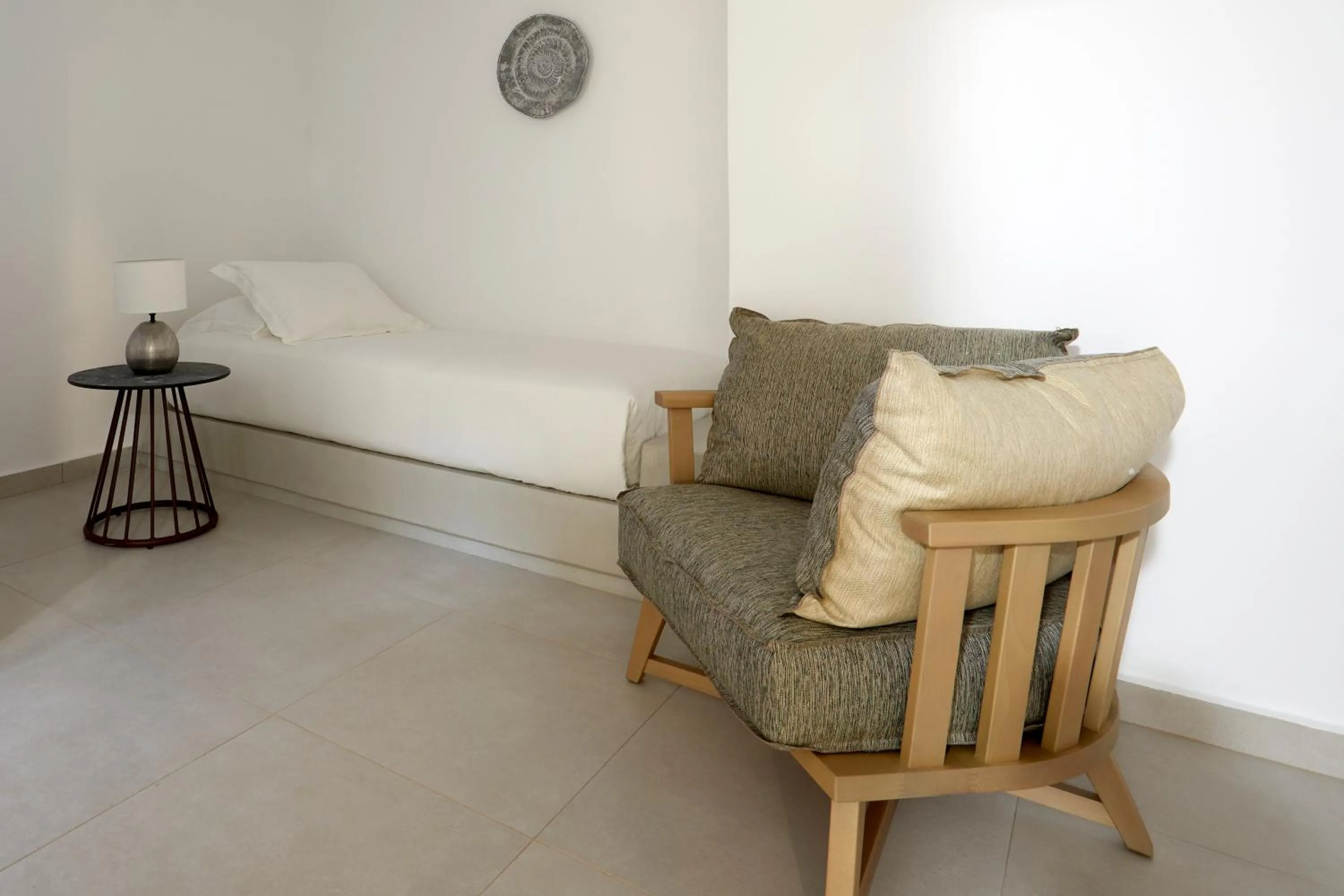 Bed in Sea Breeze Santorini Beach Resort, Curio By Hilton