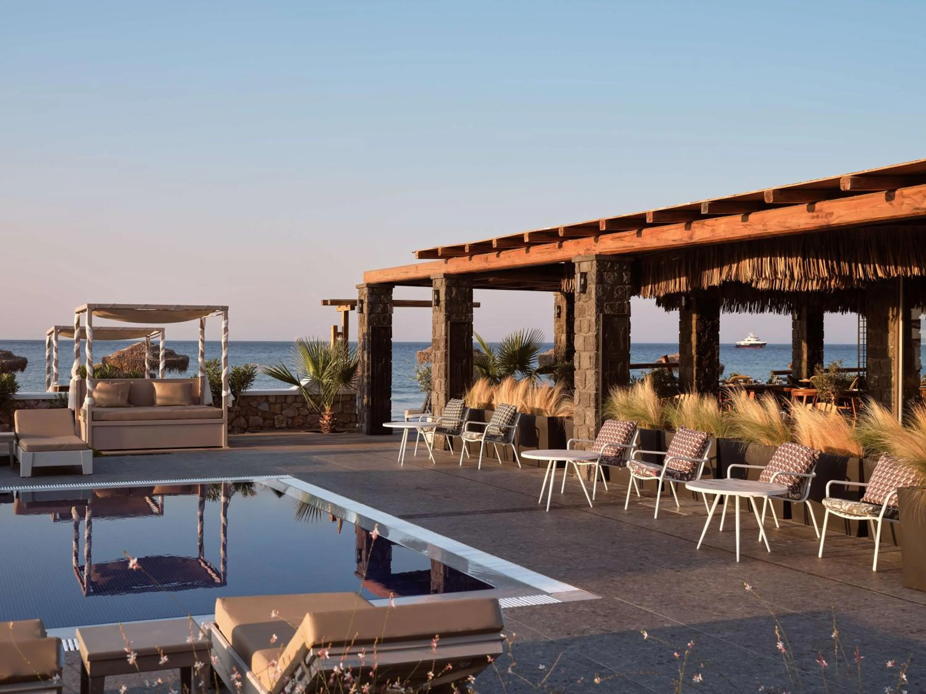 Pool view in Sea Breeze Santorini Beach Resort, Curio By Hilton
