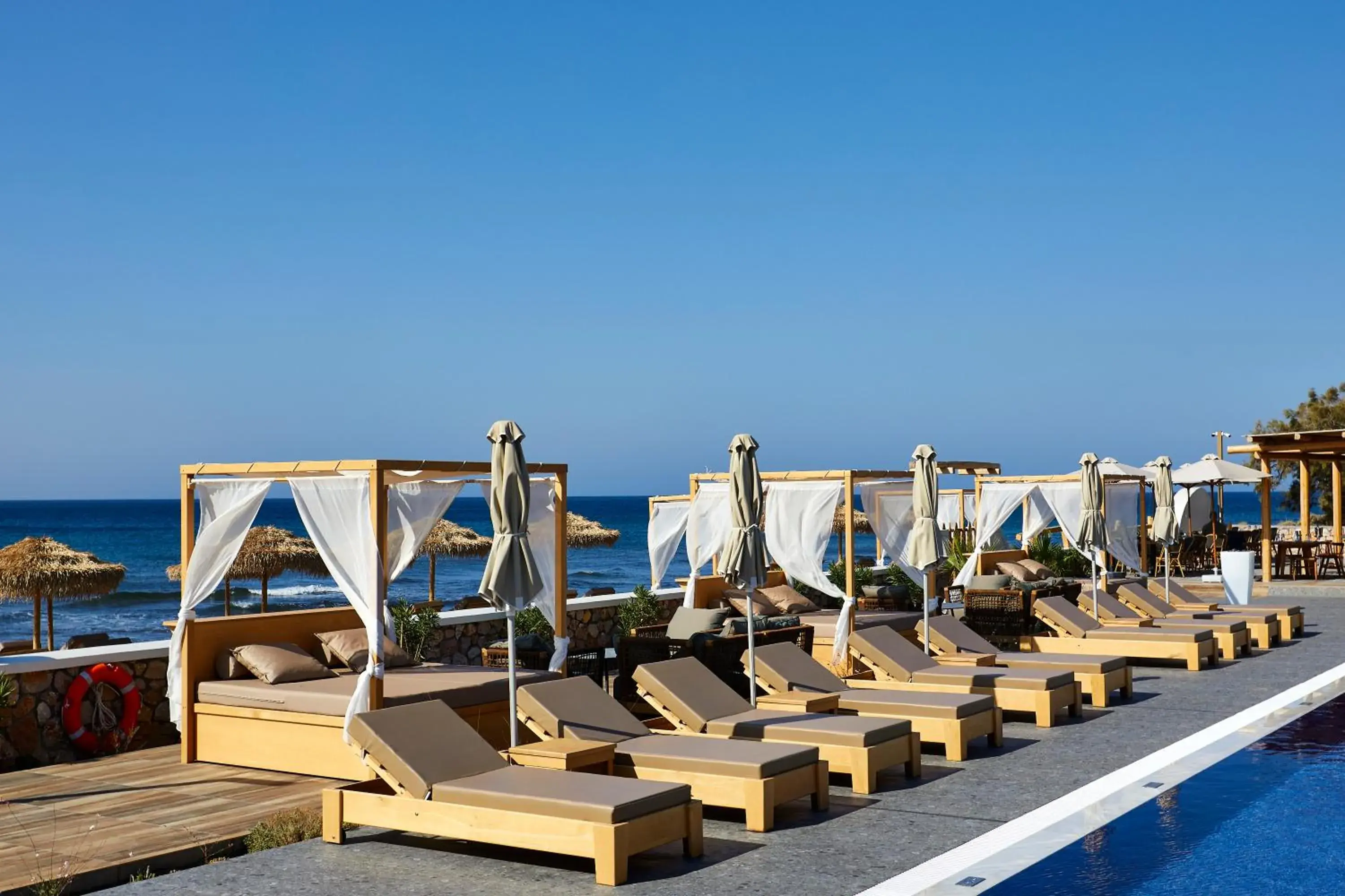 Swimming pool in Sea Breeze Santorini Beach Resort, Curio By Hilton Swimming pool in Sea Breeze Santorini Beach Resort, Curio By Hilton