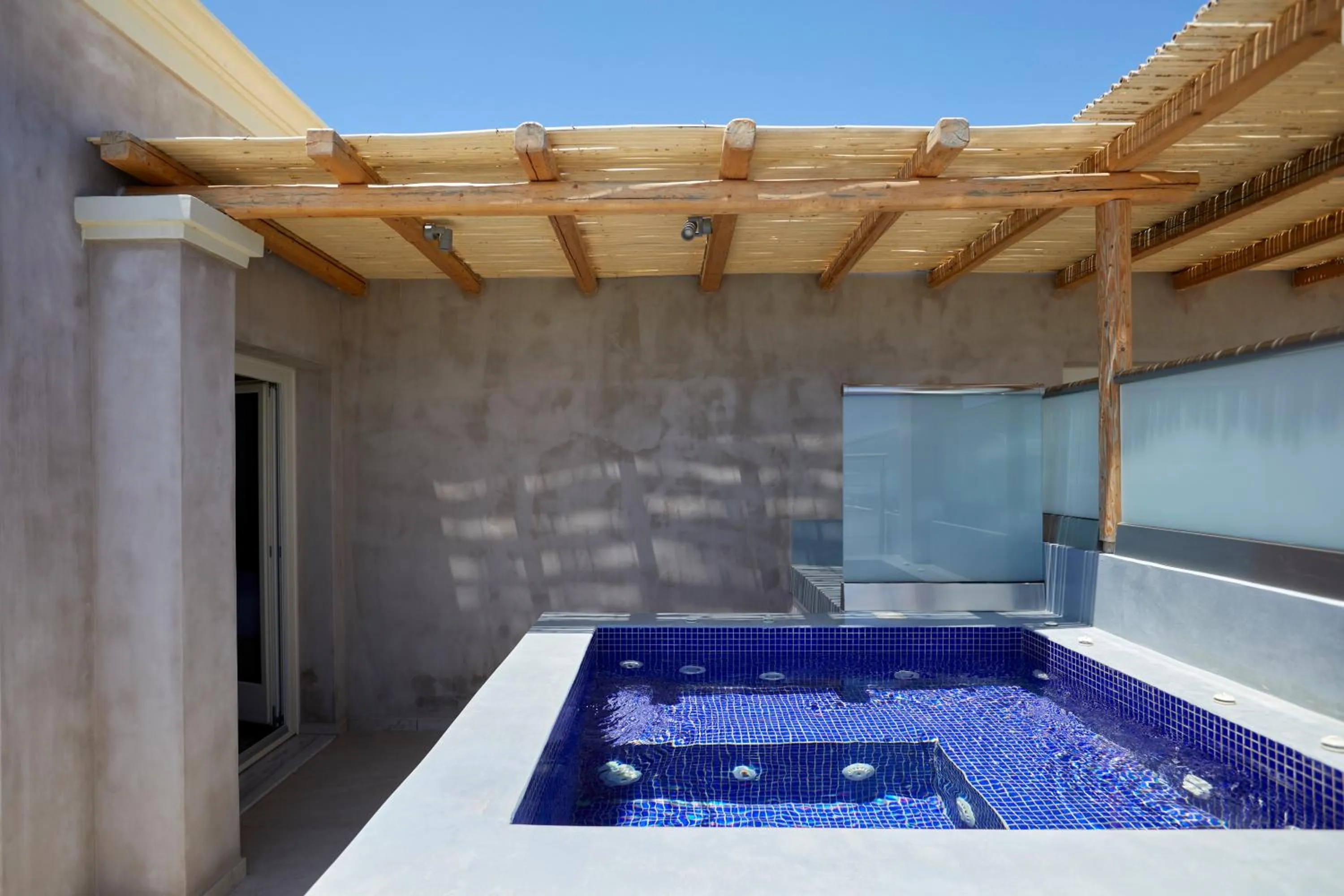 Hot Tub in Sea Breeze Santorini Beach Resort, Curio By Hilton