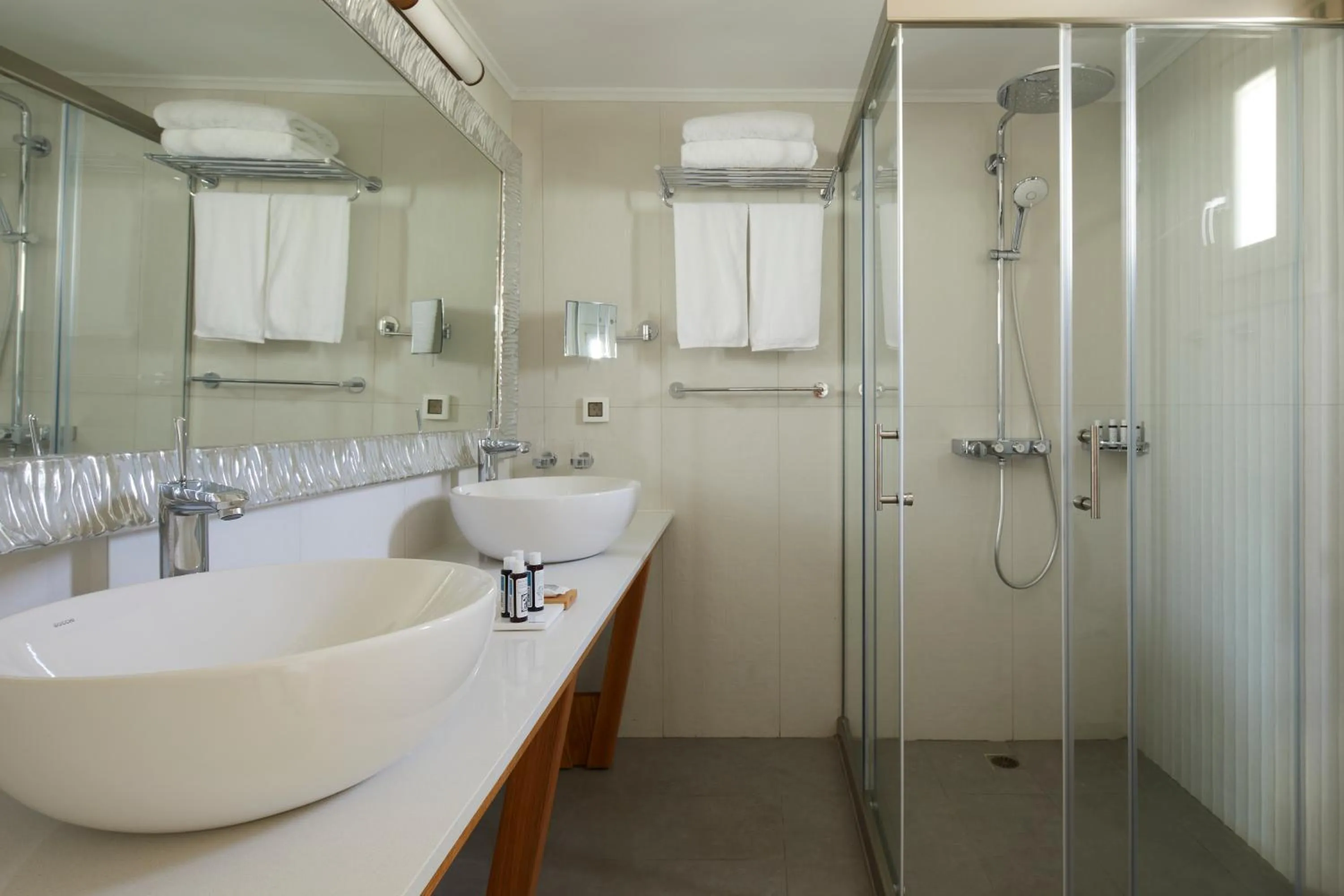 Shower in Sea Breeze Santorini Beach Resort, Curio By Hilton