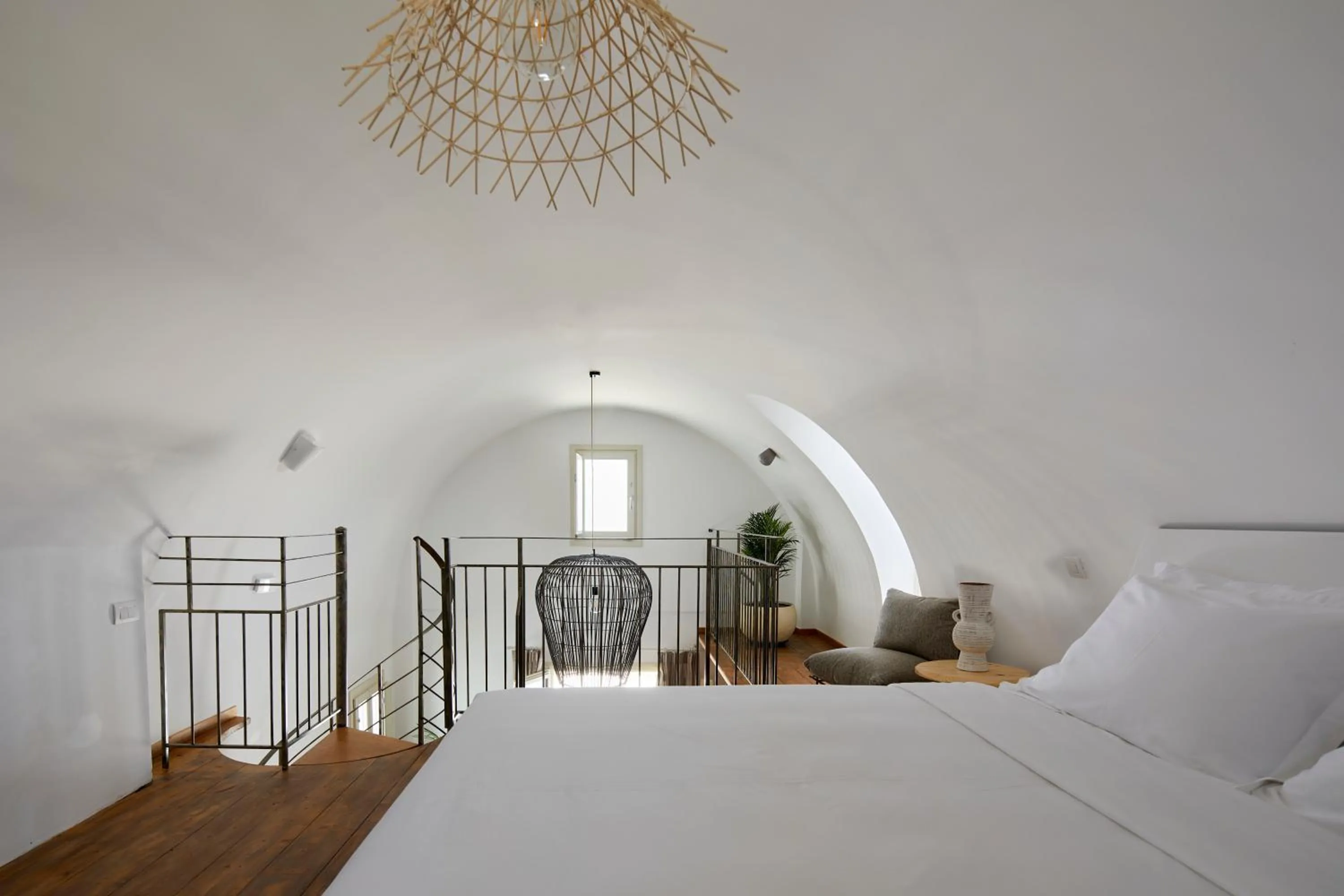 Bed in Sea Breeze Santorini Beach Resort, Curio By Hilton