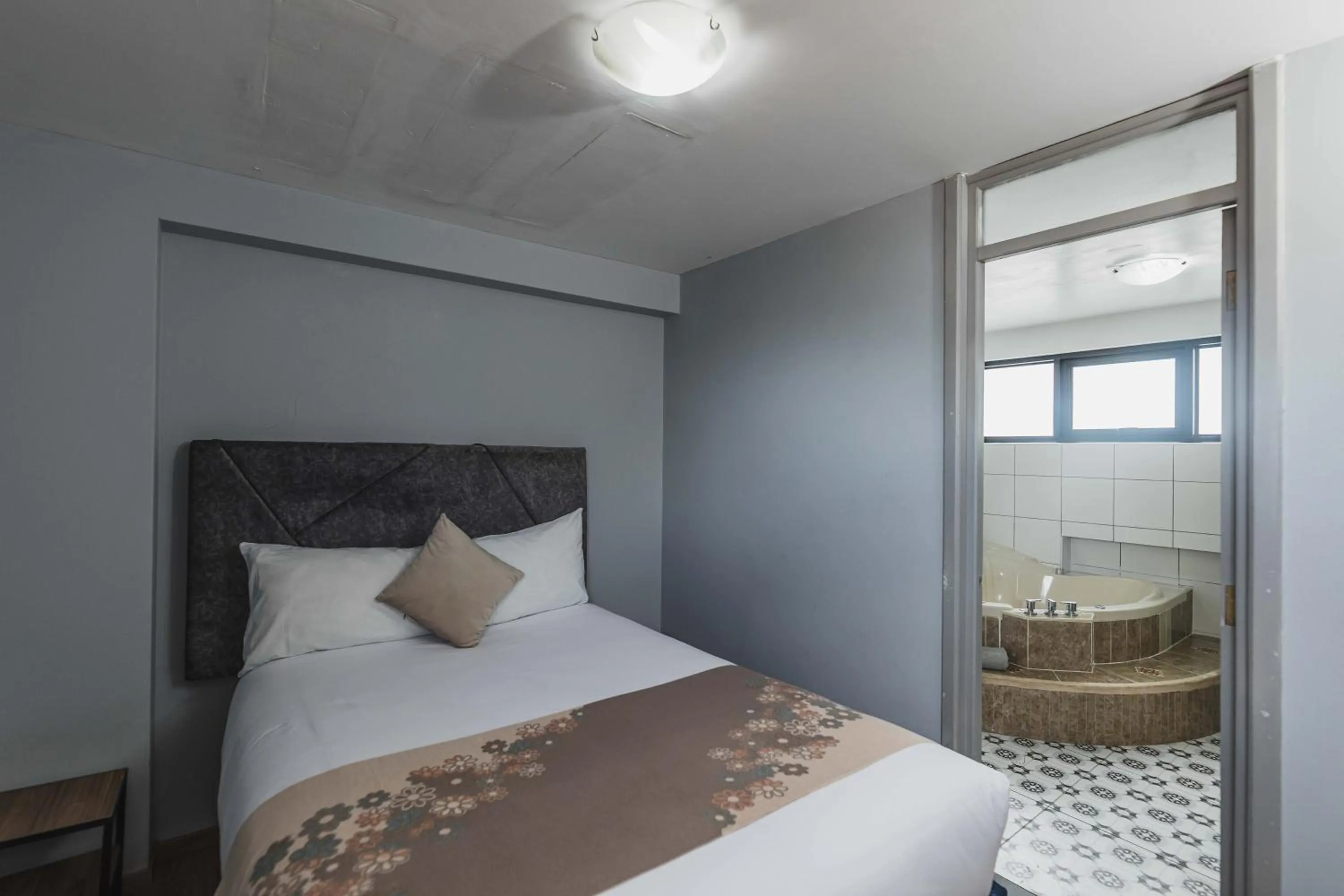 Bed in San Pedro Apartments