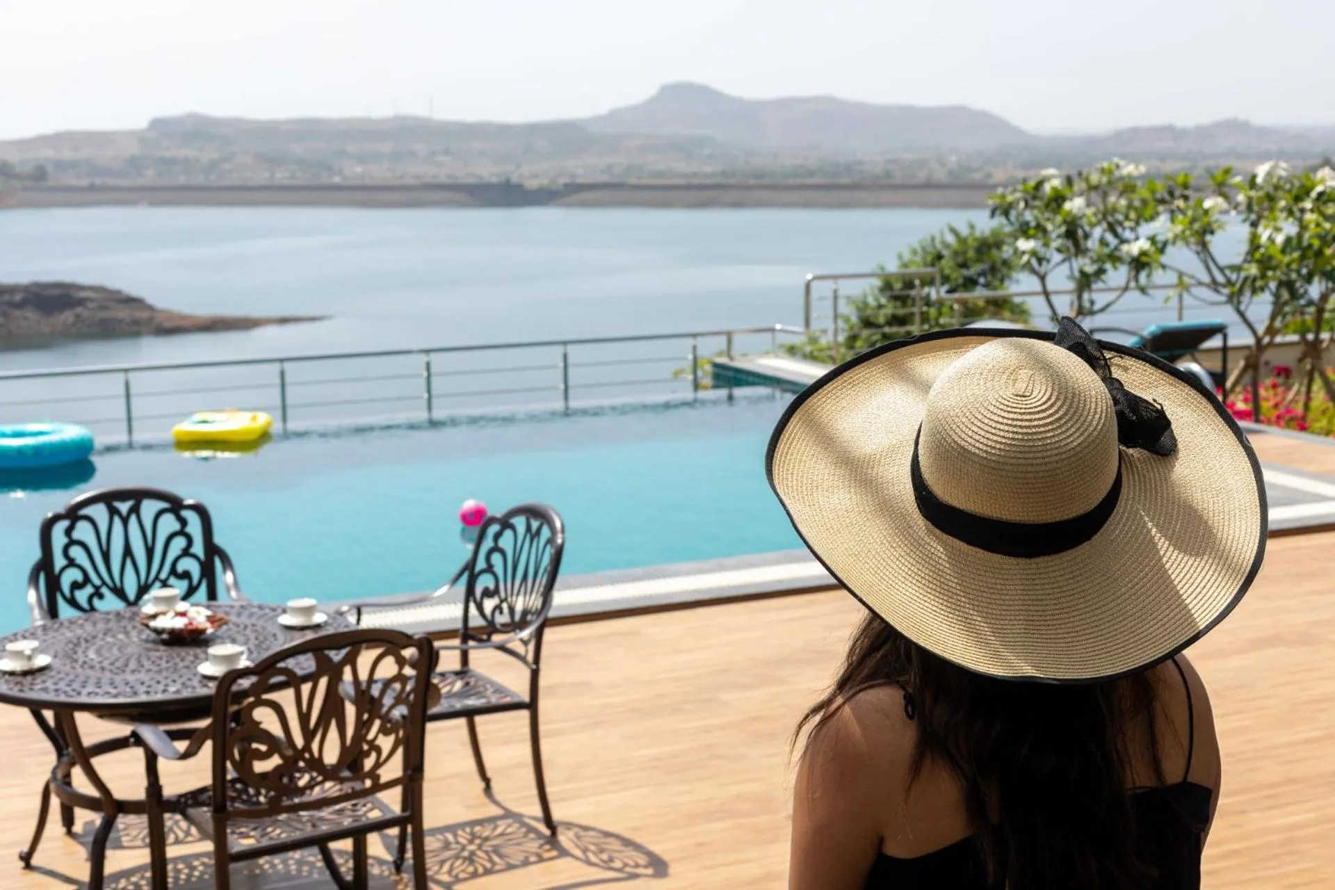Swimming pool in Lake Arches by StayVista - Lakeside villa with Infinity pool, Gazebo & Modern Greek interiors