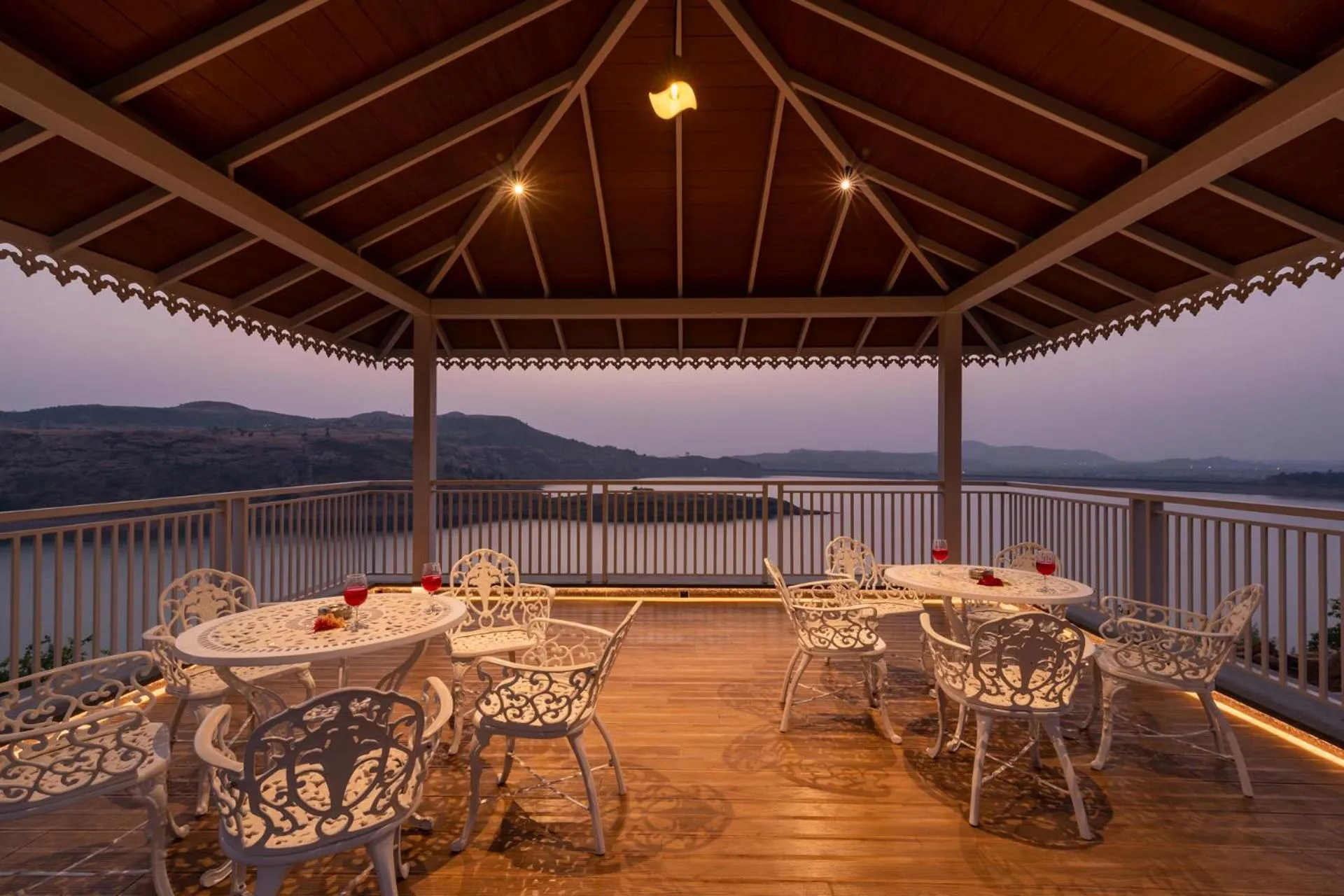 Seating area in Lake Arches by StayVista - Lakeside villa with Infinity pool, Gazebo & Modern Greek interiors
