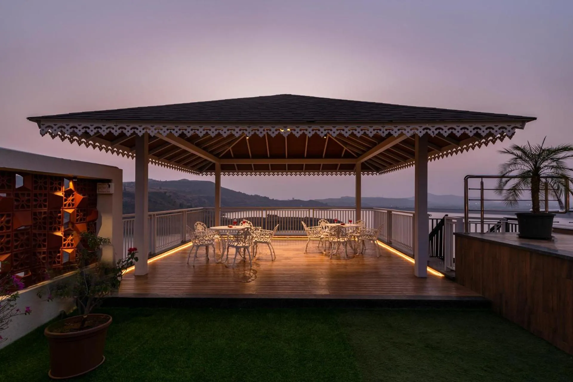Seating area in Lake Arches by StayVista - Lakeside villa with Infinity pool, Gazebo & Modern Greek interiors