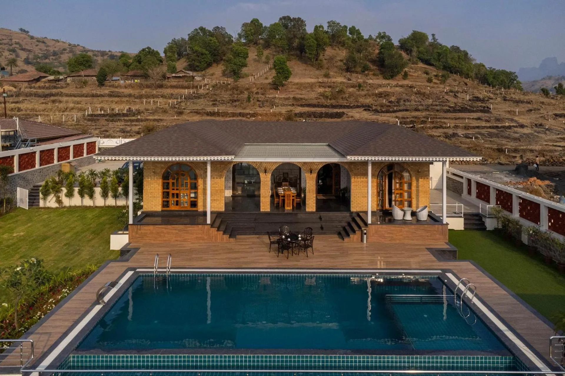 Property building in Lake Arches by StayVista - Lakeside villa with Infinity pool, Gazebo & Modern Greek interiors