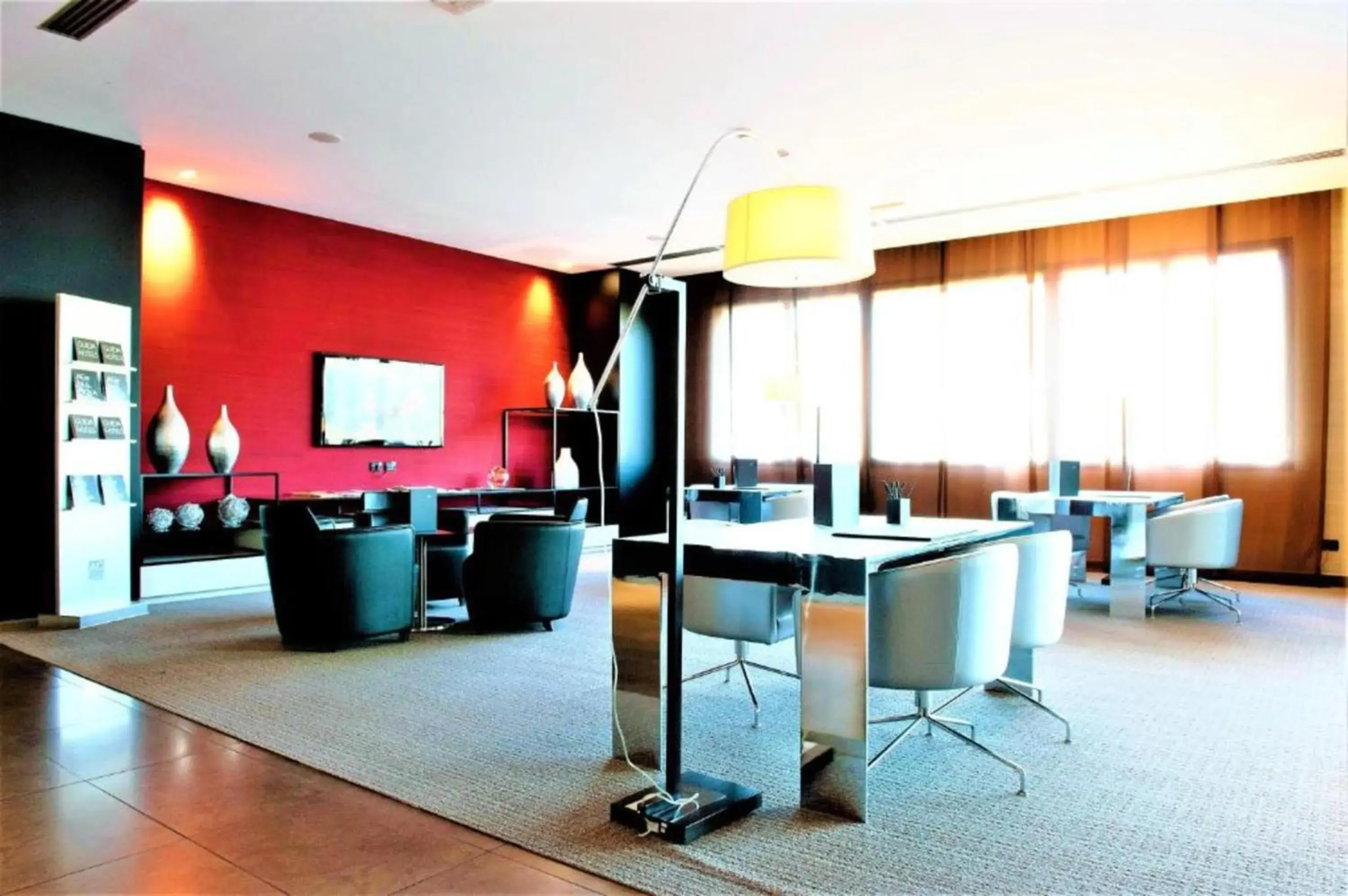 Communal lounge/ TV room in AC Hotel Padova by Marriott