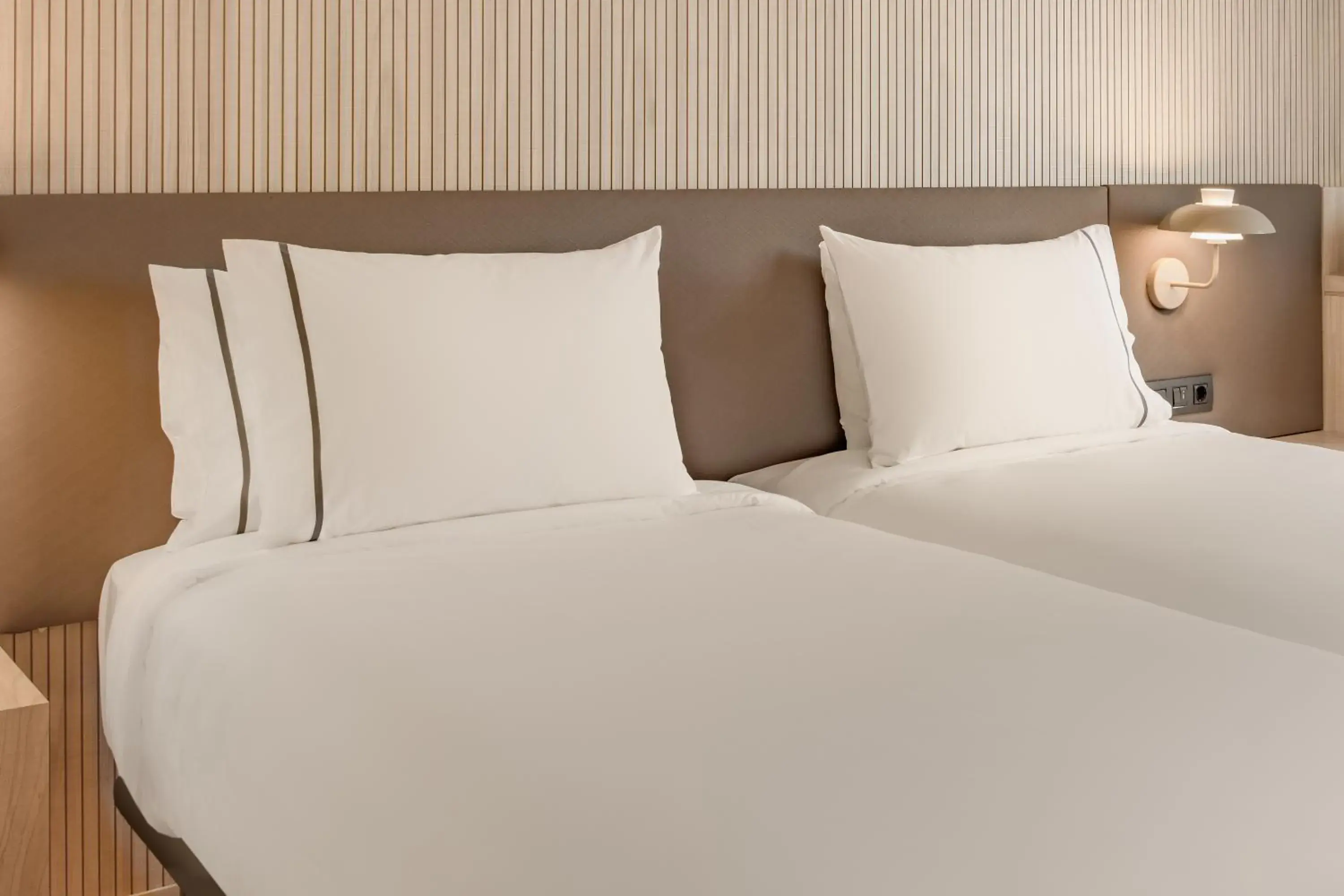 Bed in AC Hotel Padova by Marriott