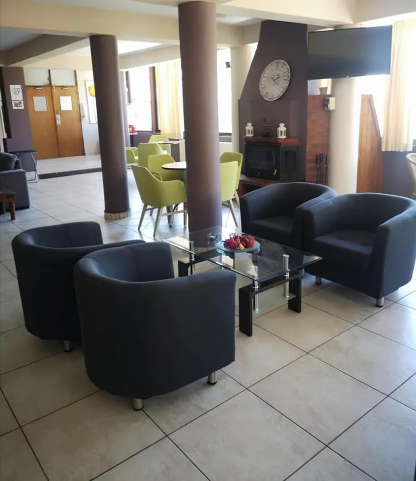 Communal lounge/ TV room in Minaides Hotel