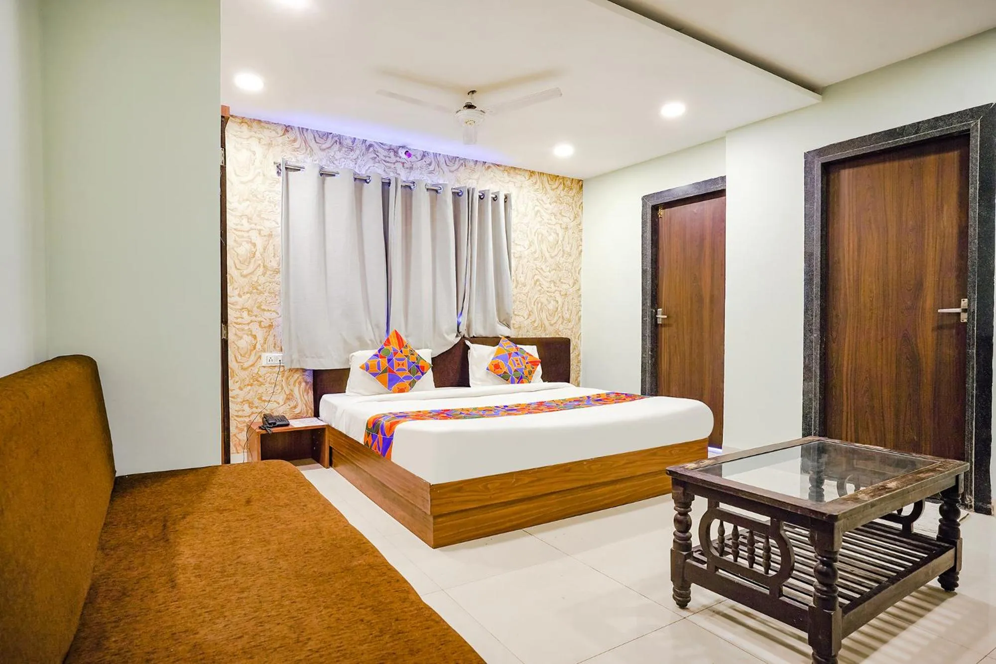 Bed in FabHotel Uday Vilas