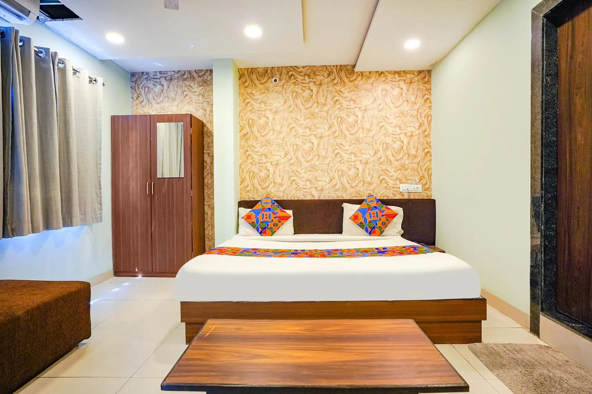 Bed in FabHotel Uday Vilas