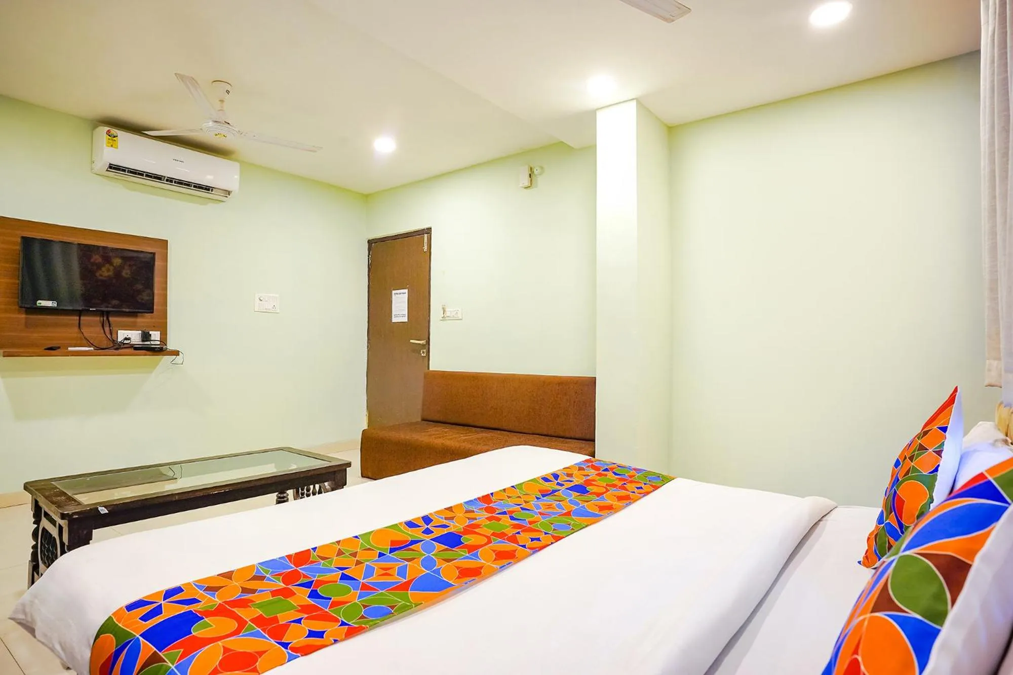Bed in FabHotel Uday Vilas