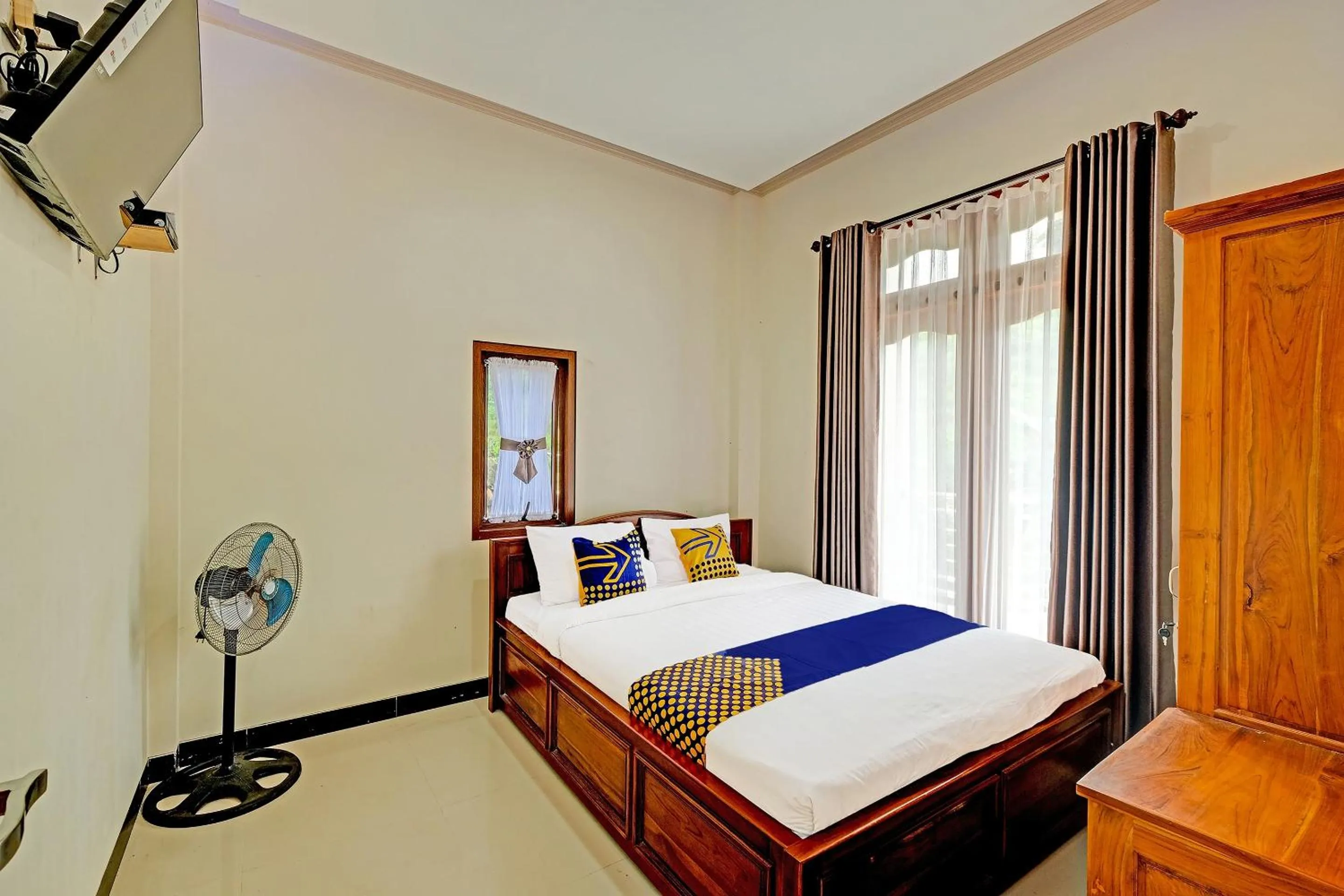 Bedroom in OYO Homes 91095 Desa Wisata Conto