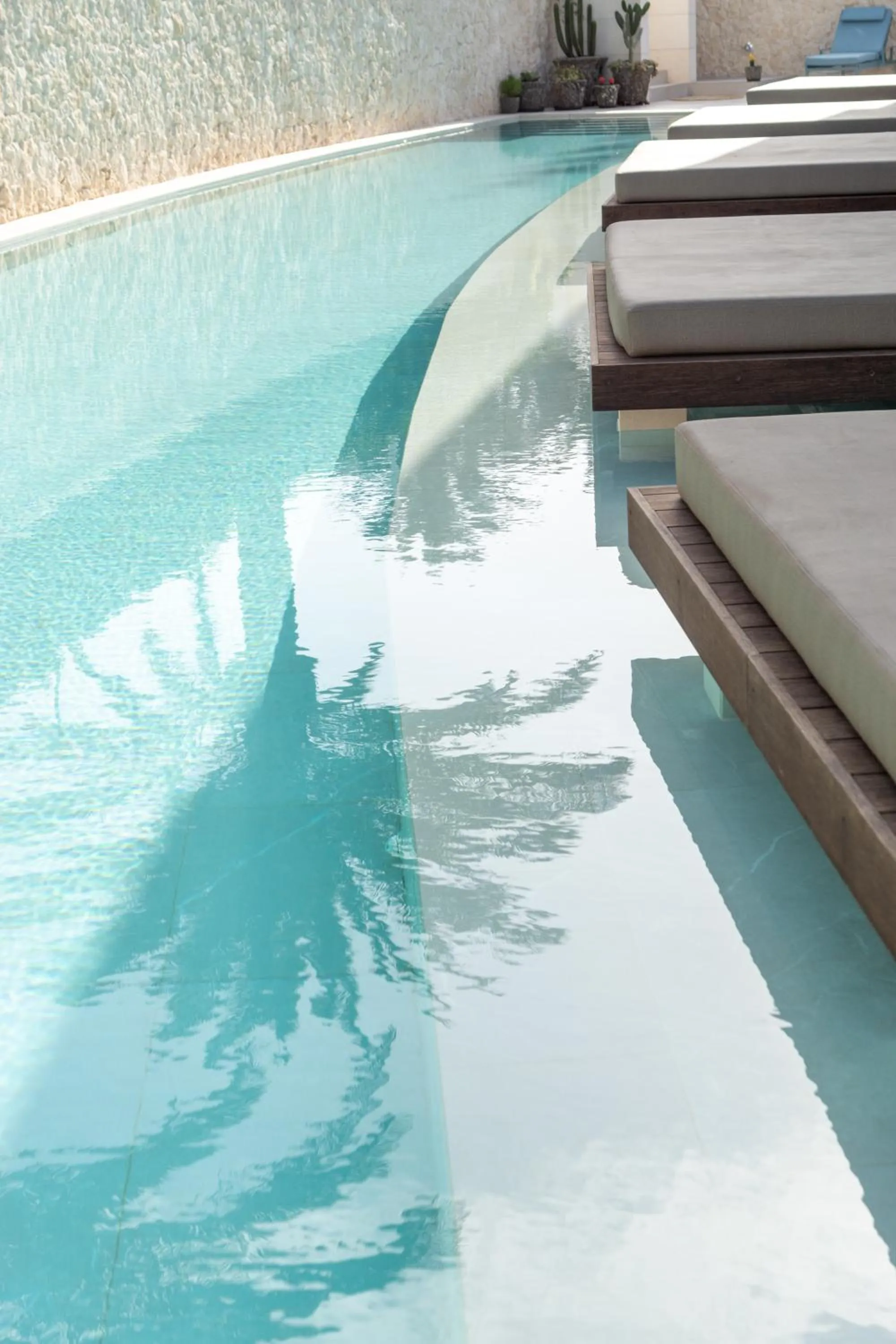 Swimming pool in TenSuites - Adults Only