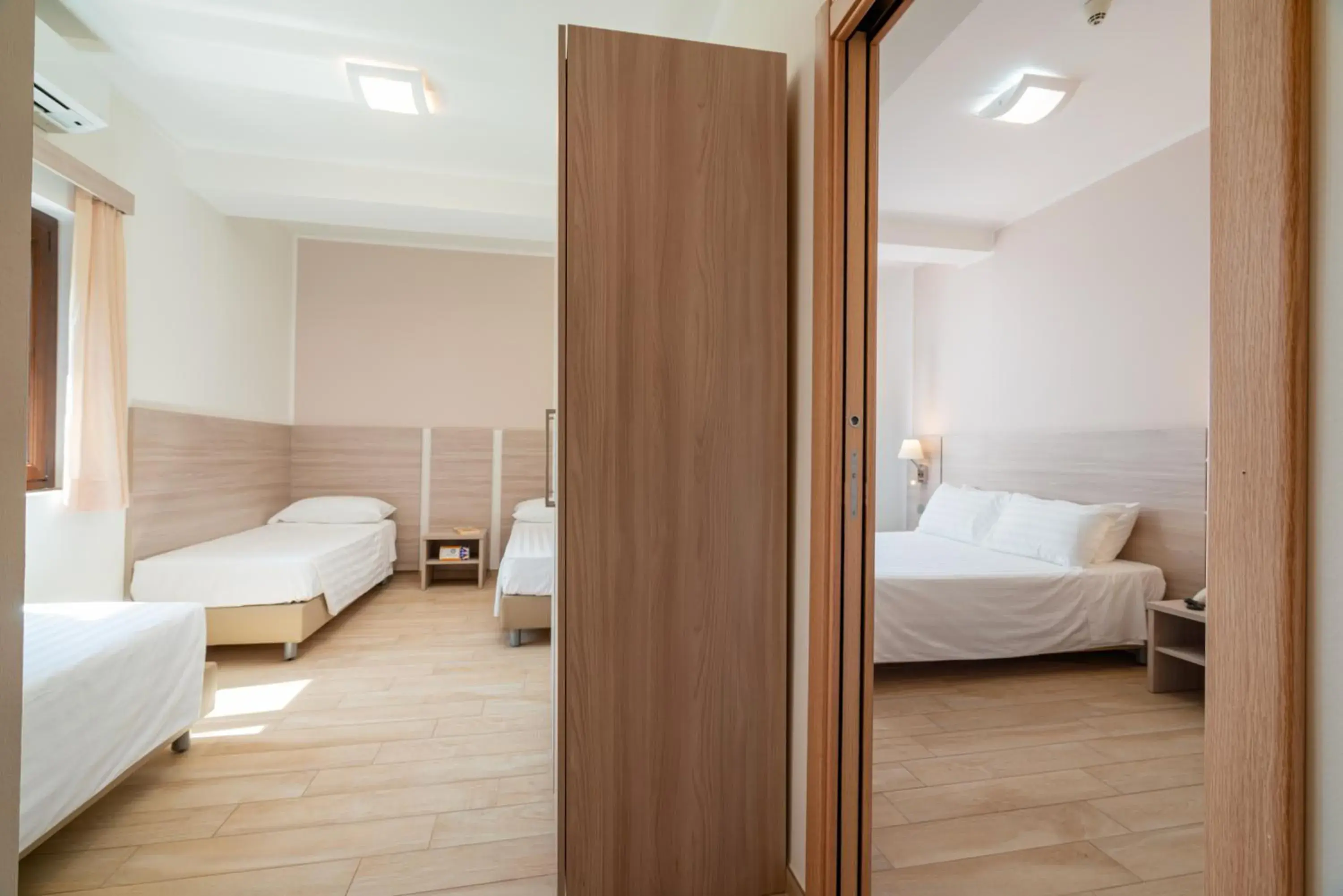 Family Room with Side Sea View in Hotel Portoconte Family Room with Side Sea View in Hotel Portoconte