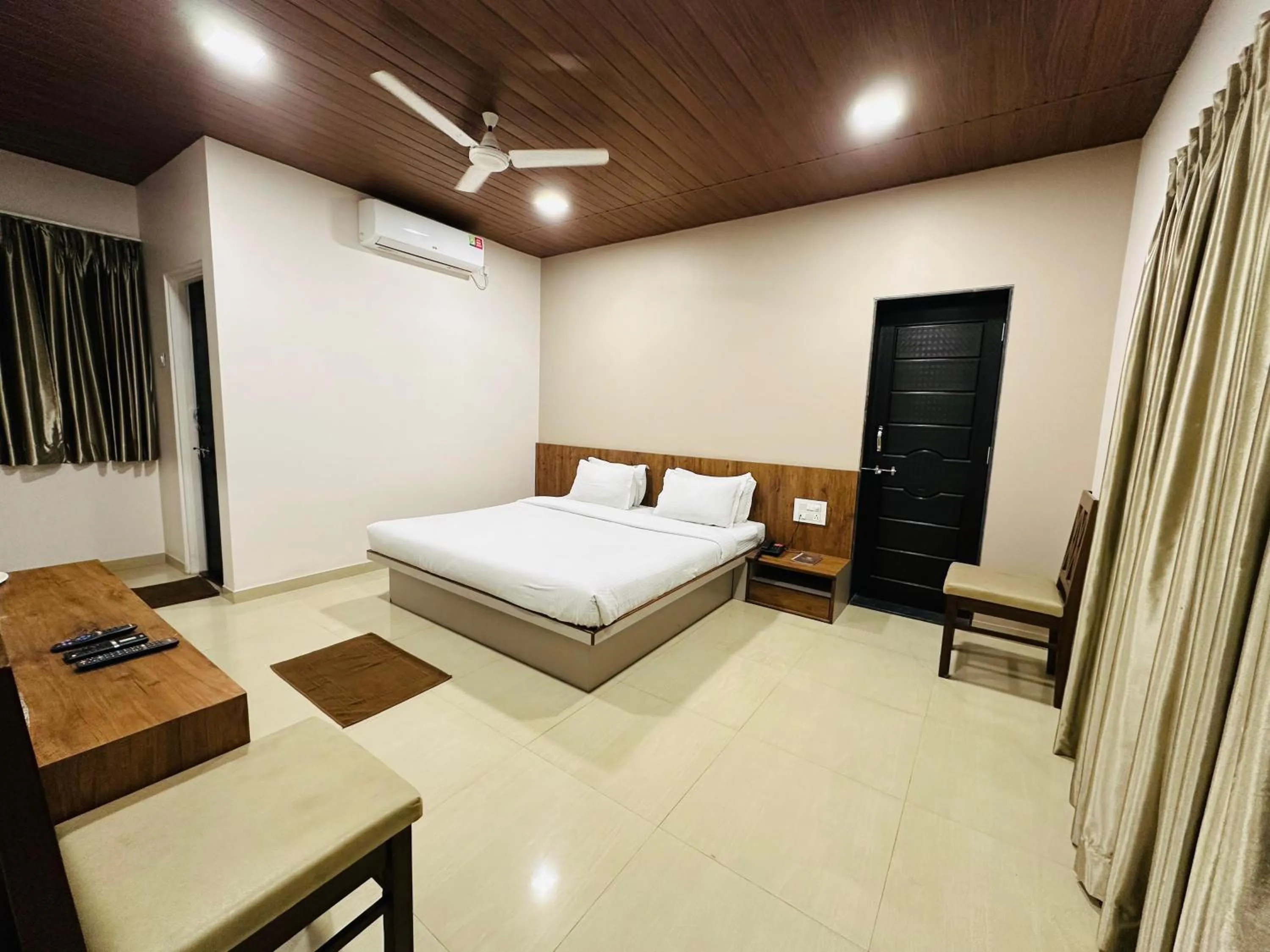 fireplace, Bed in Hotel Grand Indu, 3 Star Kolhapur