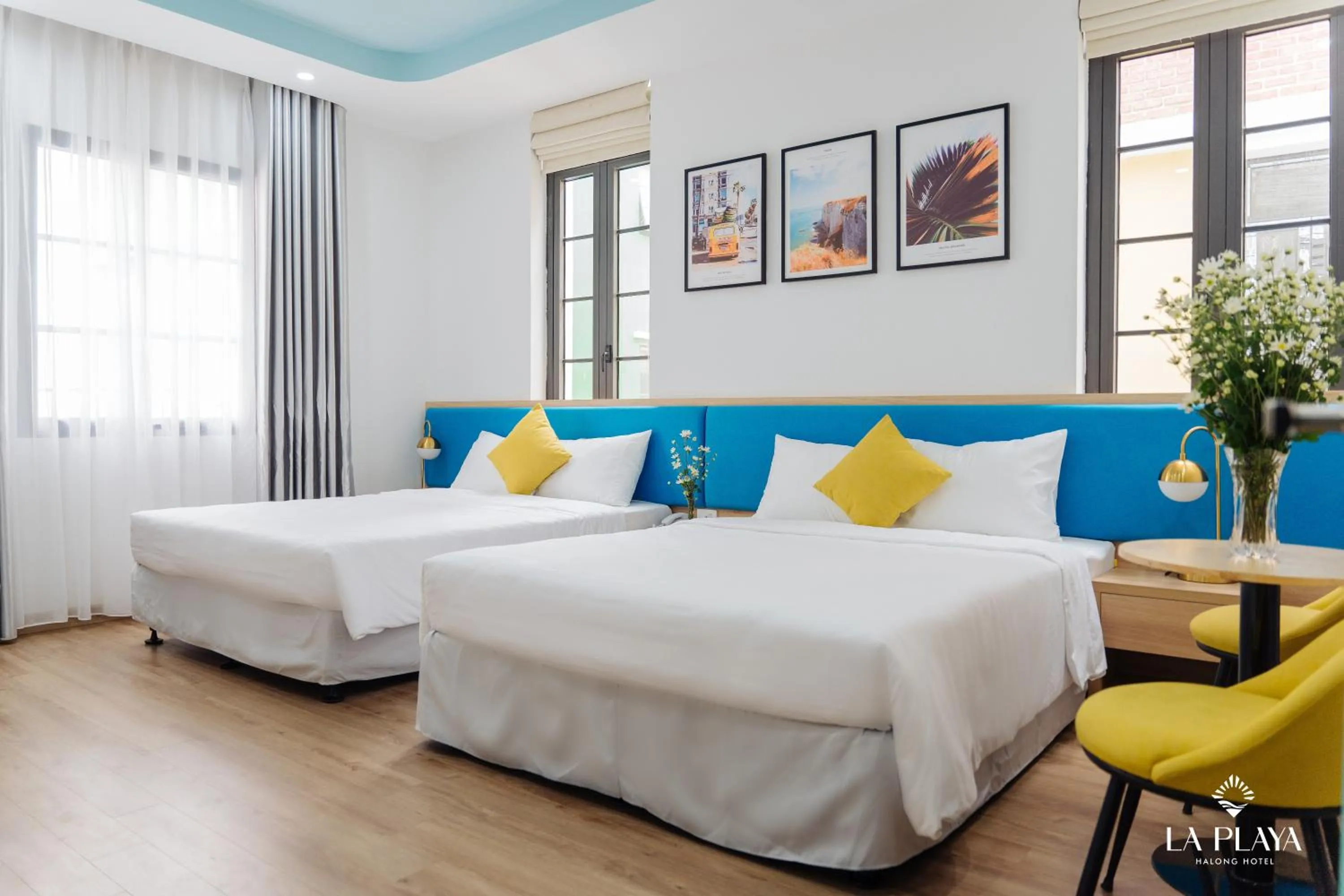 Photo of the whole room, Bed in La Playa Ha Long Hotel