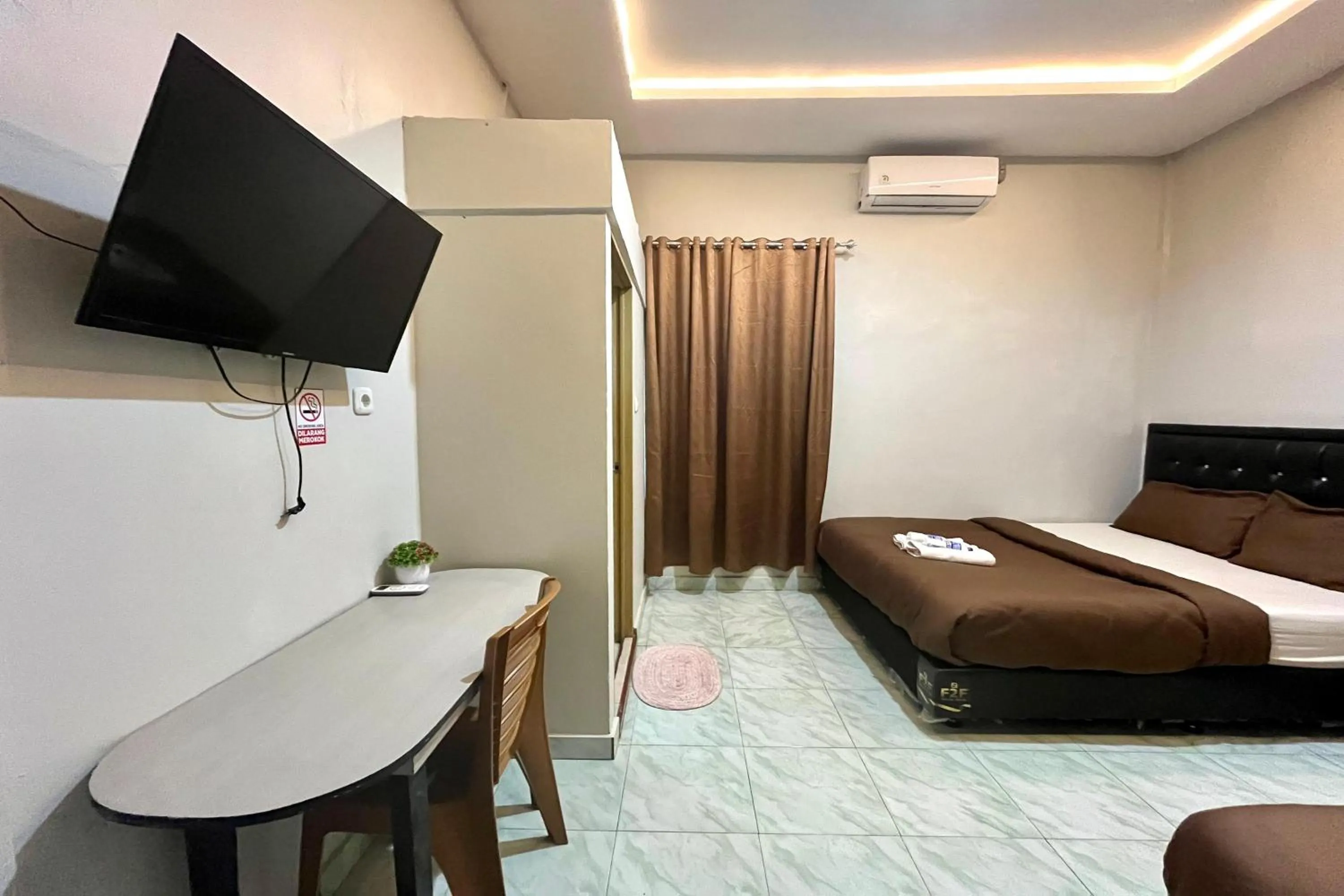 Bed in Gratia Guesthouse Syari'ah