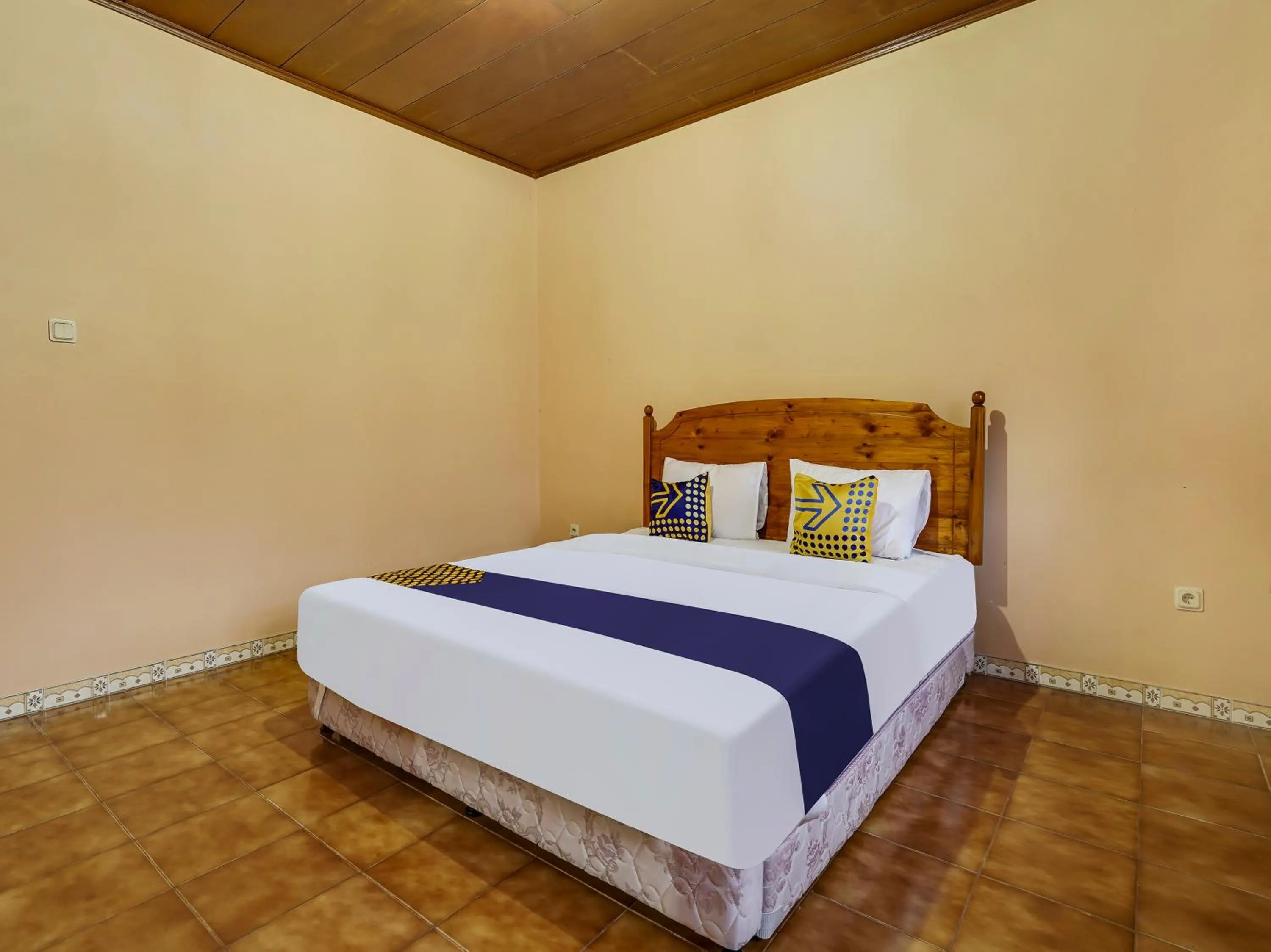 Bedroom in SPOT ON 91107 Villa Galaxy Resort