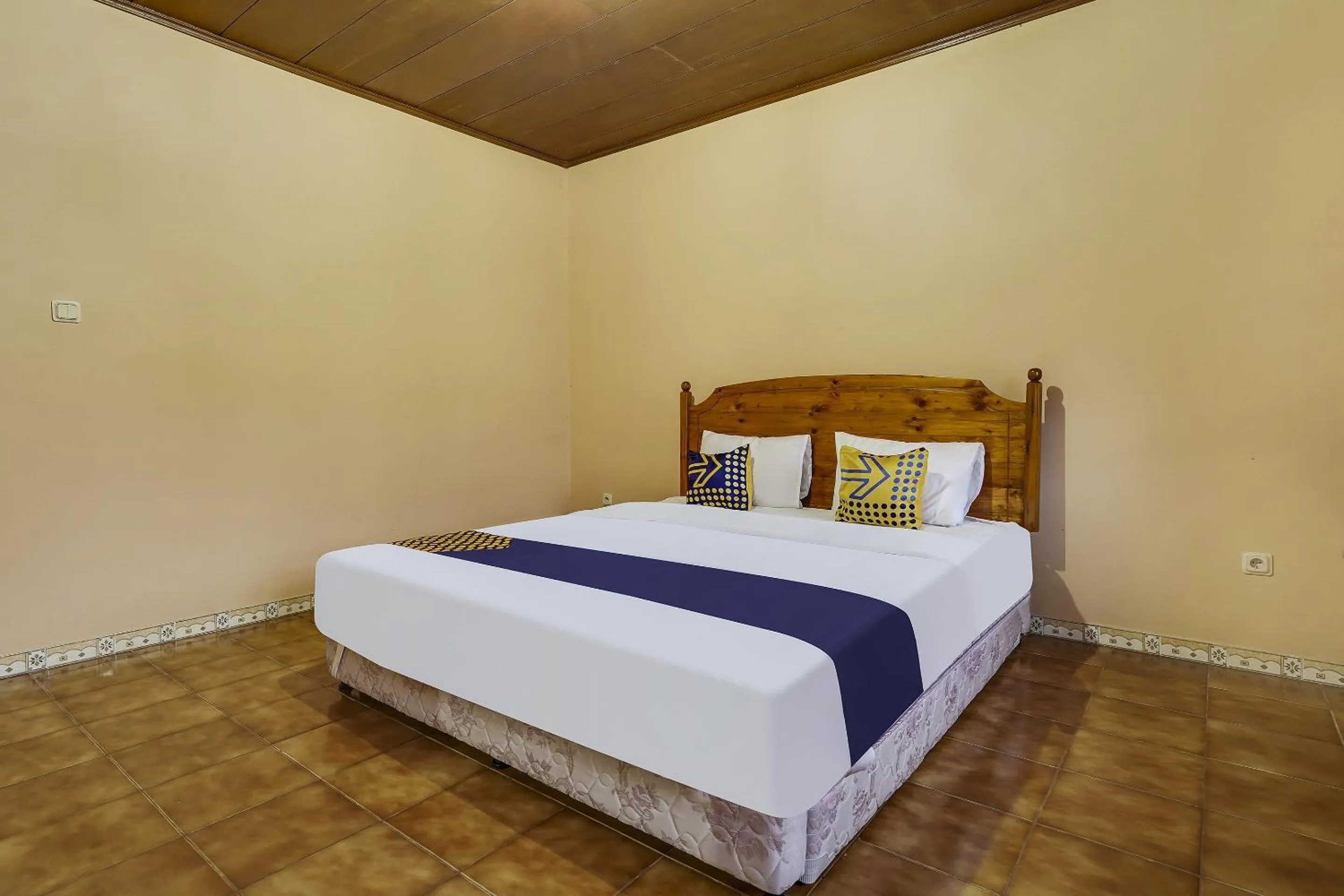 Bedroom in SPOT ON 91107 Villa Galaxy Resort