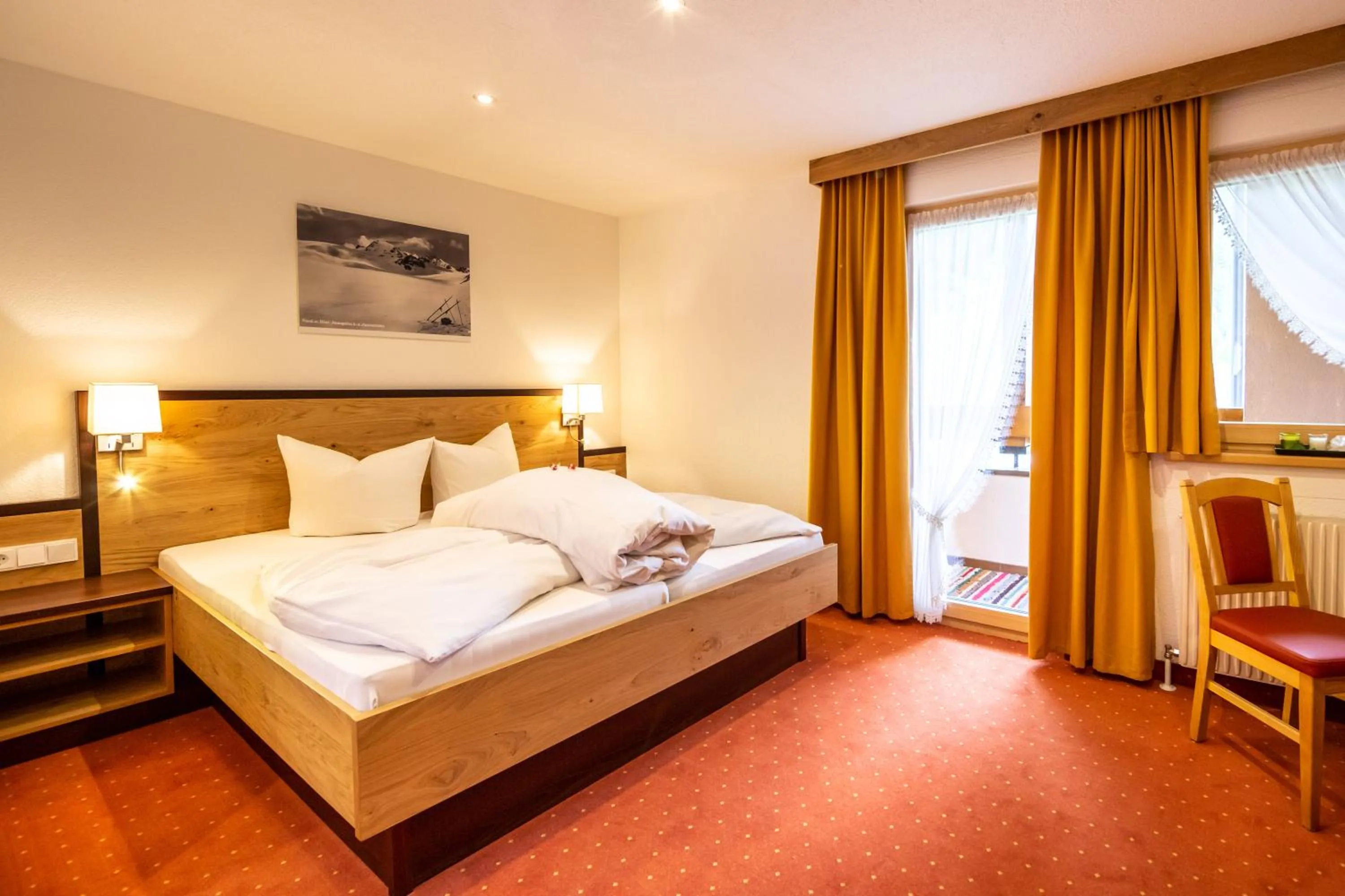 Bed in Hotel Garni Tyola