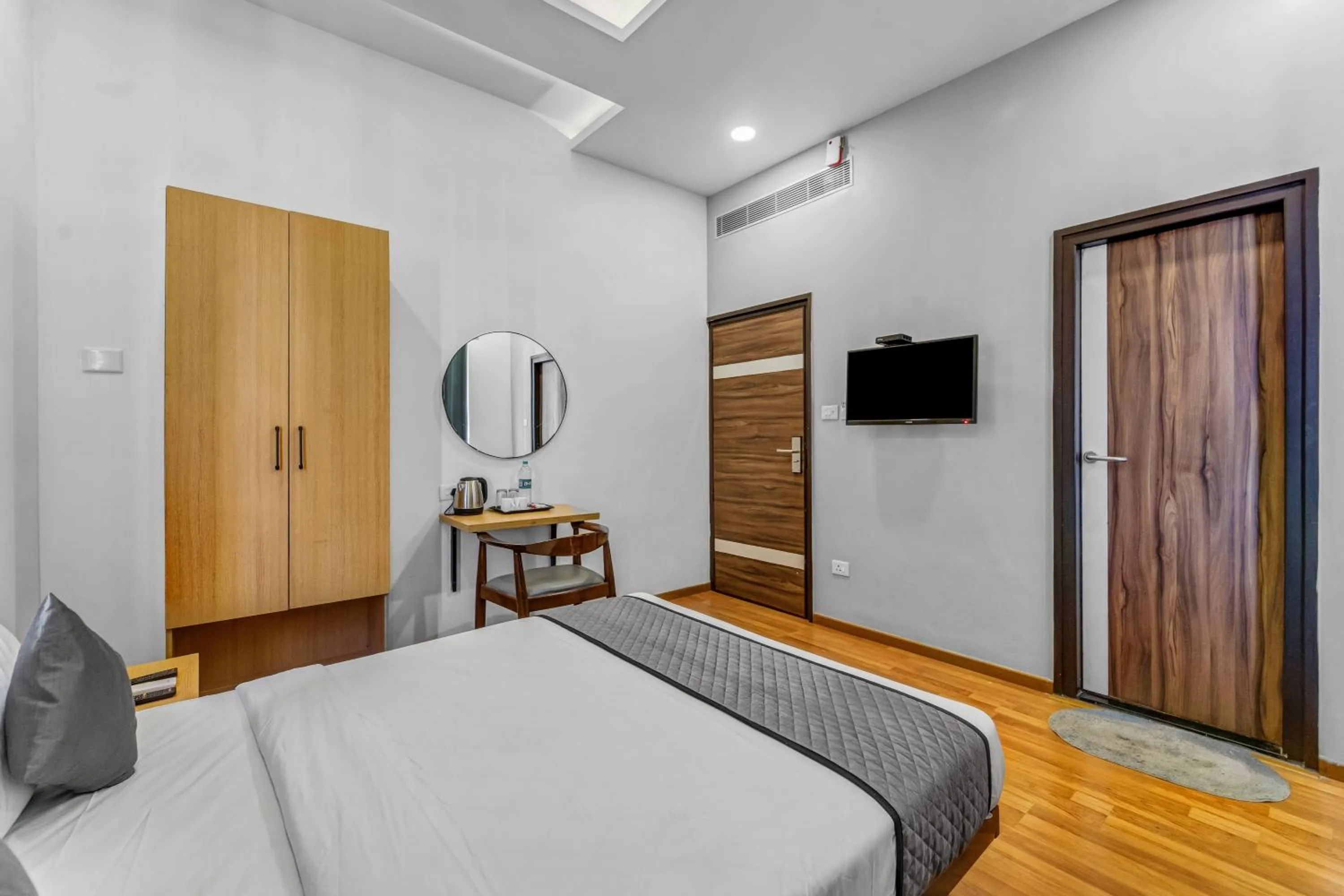 wardrobe, Bed in UPAR Hotels - T Nagar