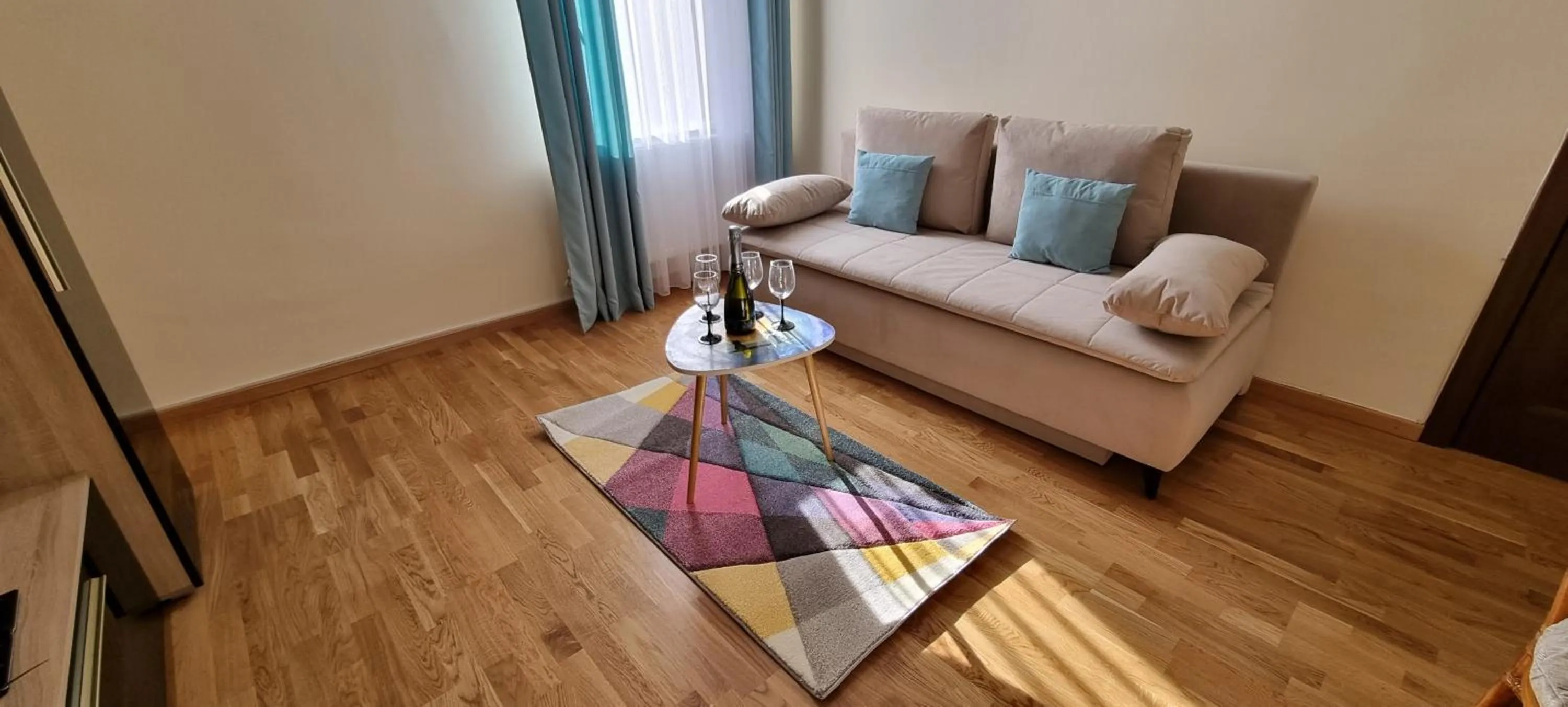 Living room in Happy Mood Apartments