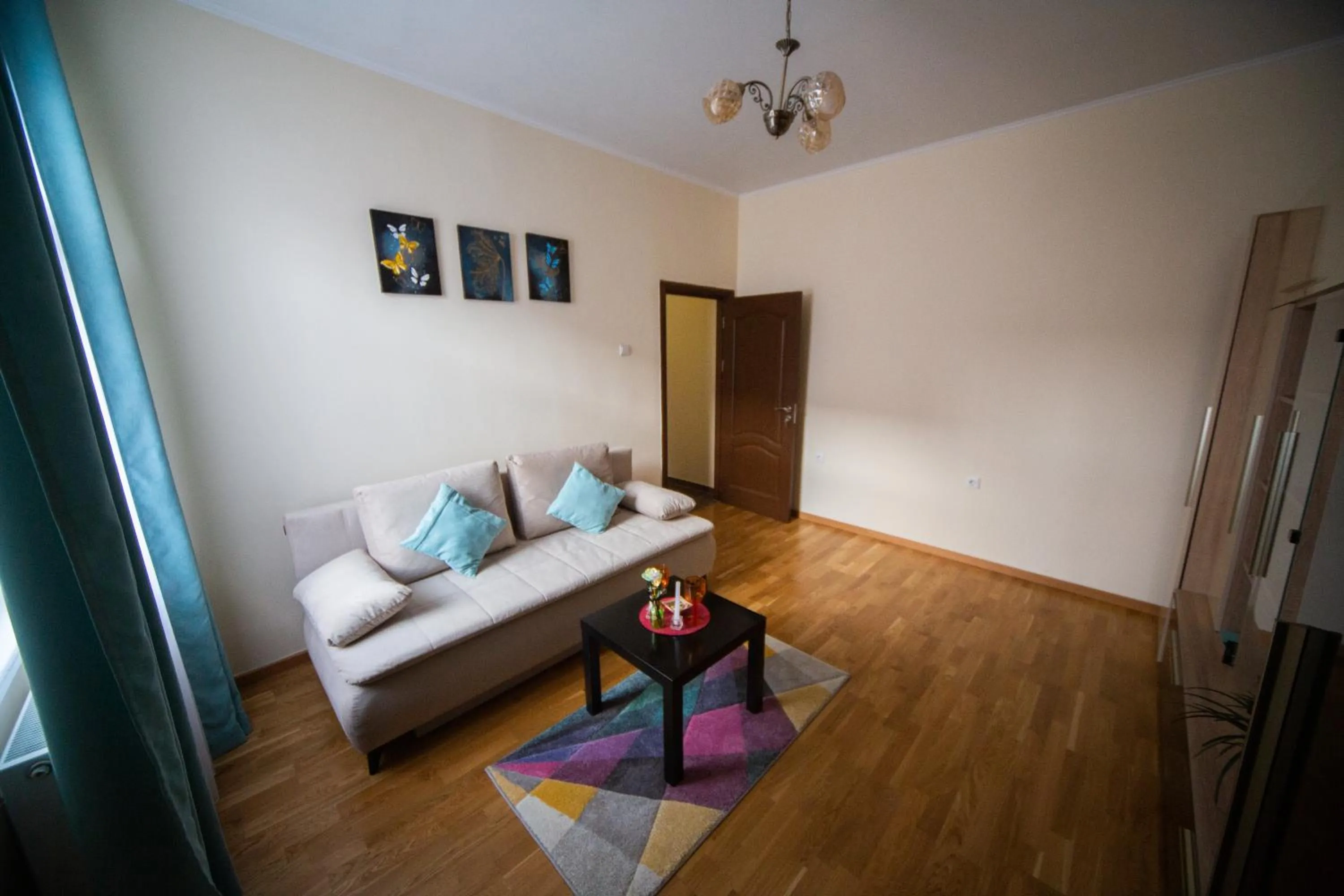 Living room in Happy Mood Apartments