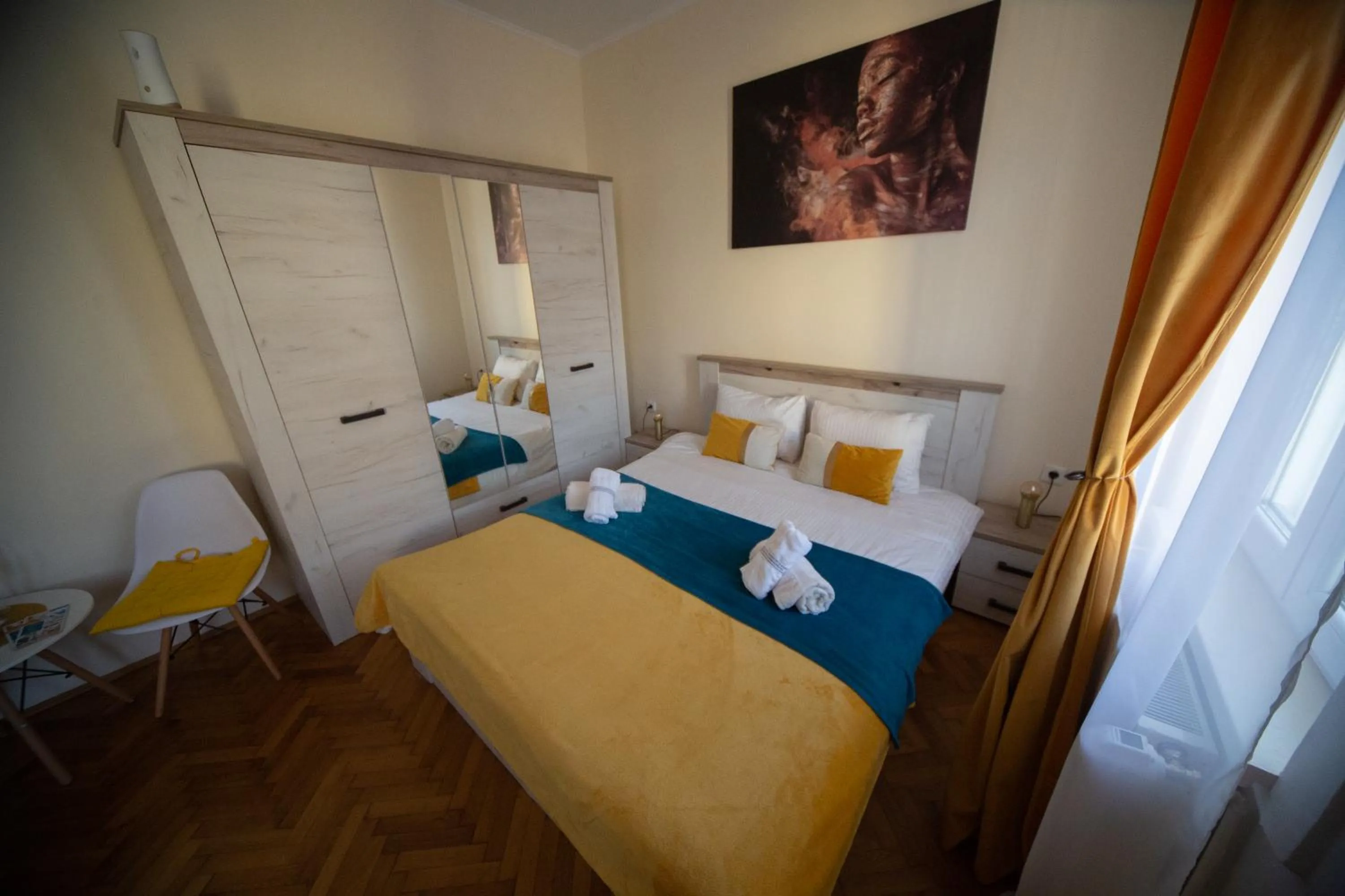 Bed in Happy Mood Apartments