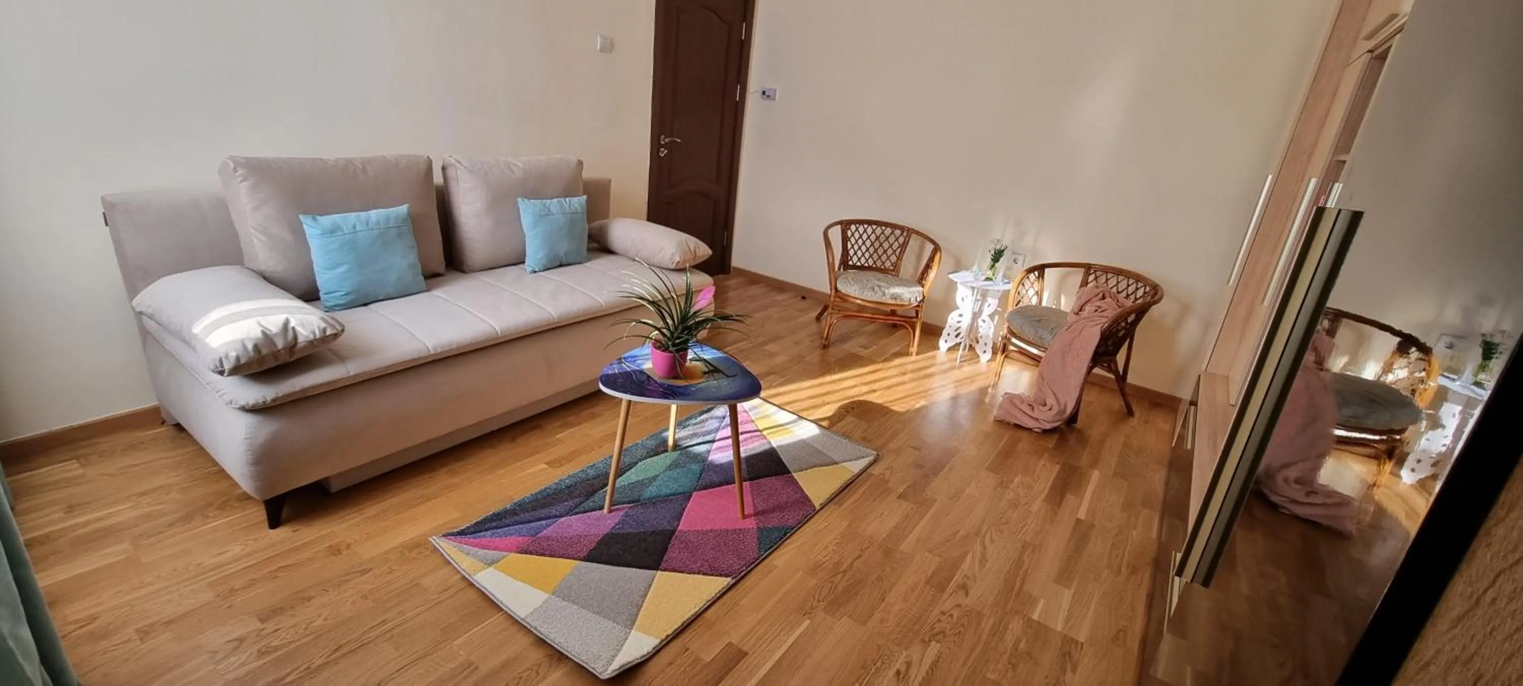 Living room in Happy Mood Apartments