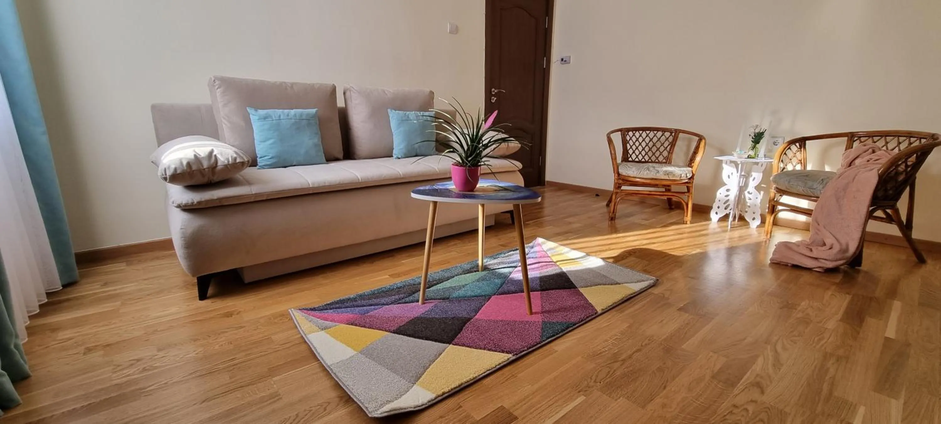 Living room in Happy Mood Apartments