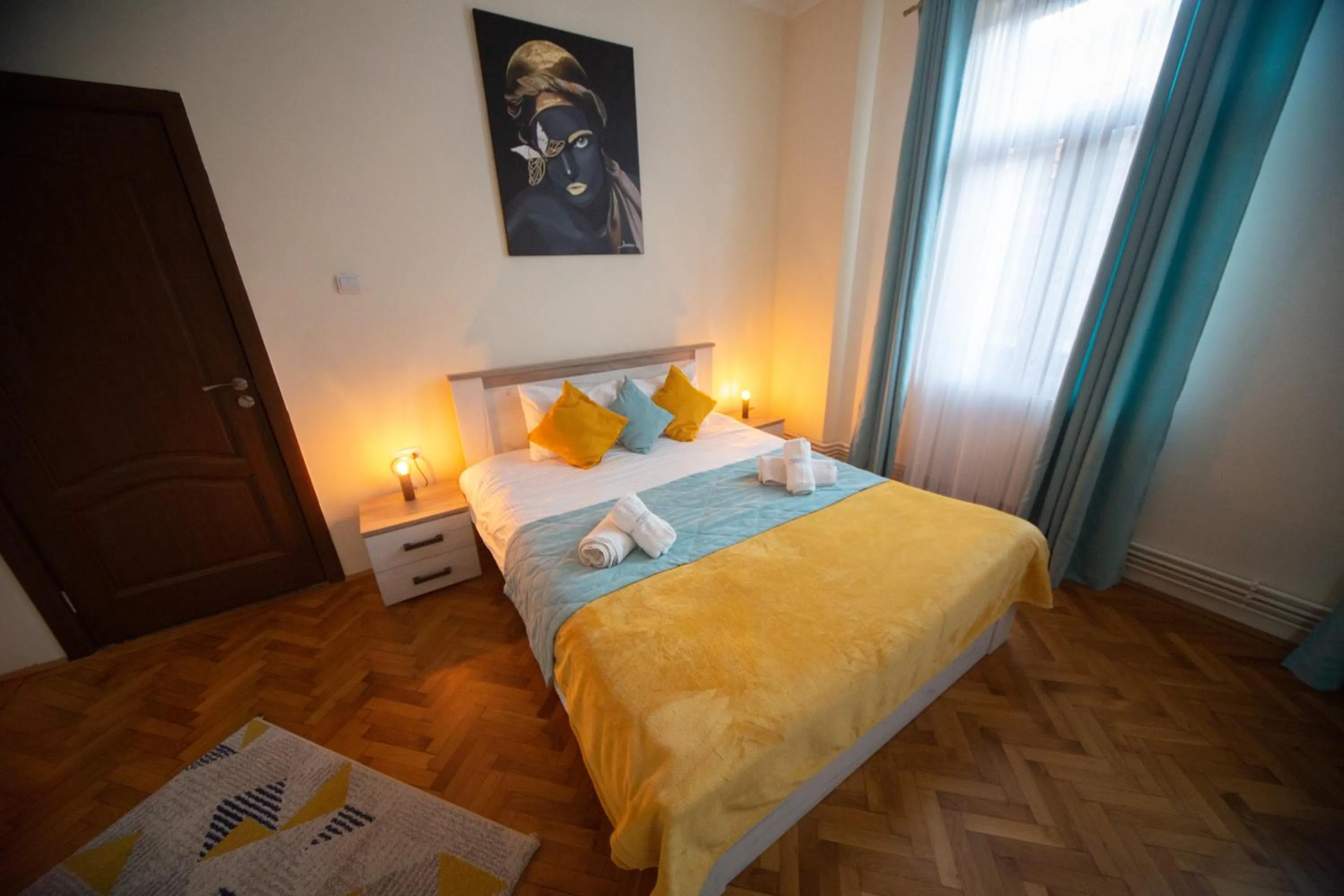 Bed in Happy Mood Apartments