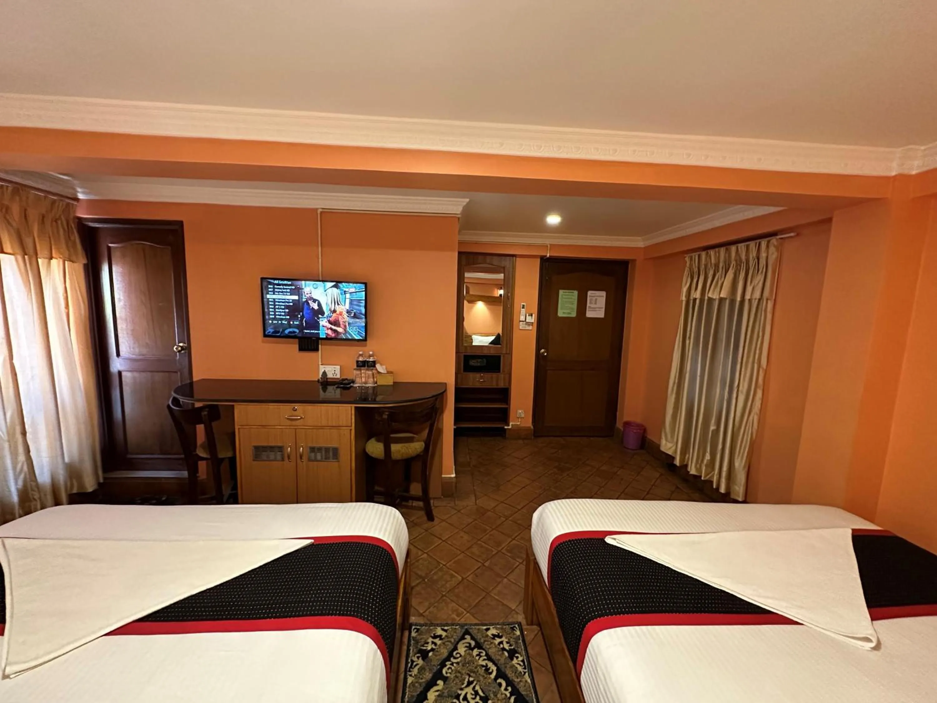 Bed in Hotel Empire & Rooftop Restaurant