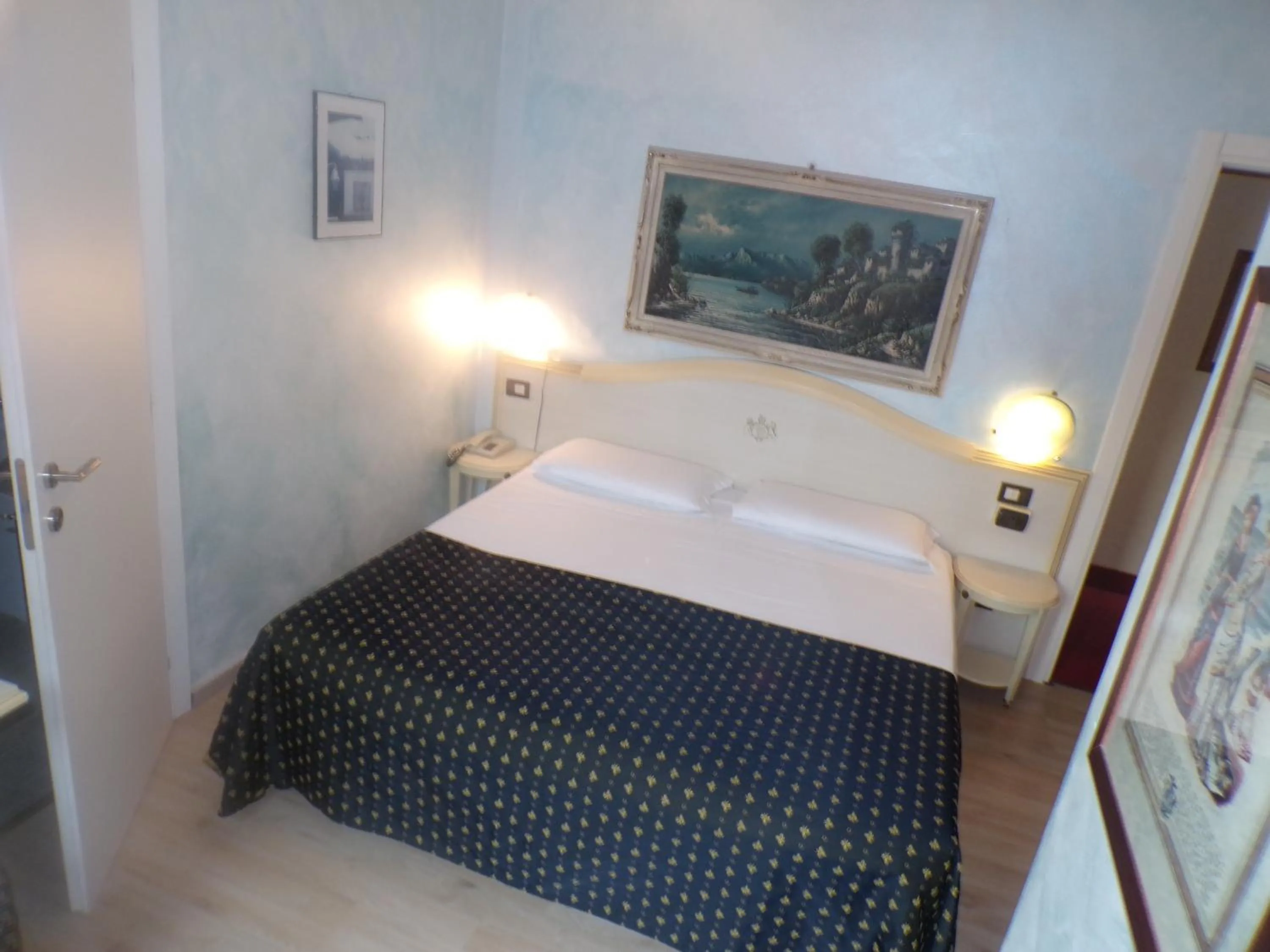 Bed in Hotel San Marino