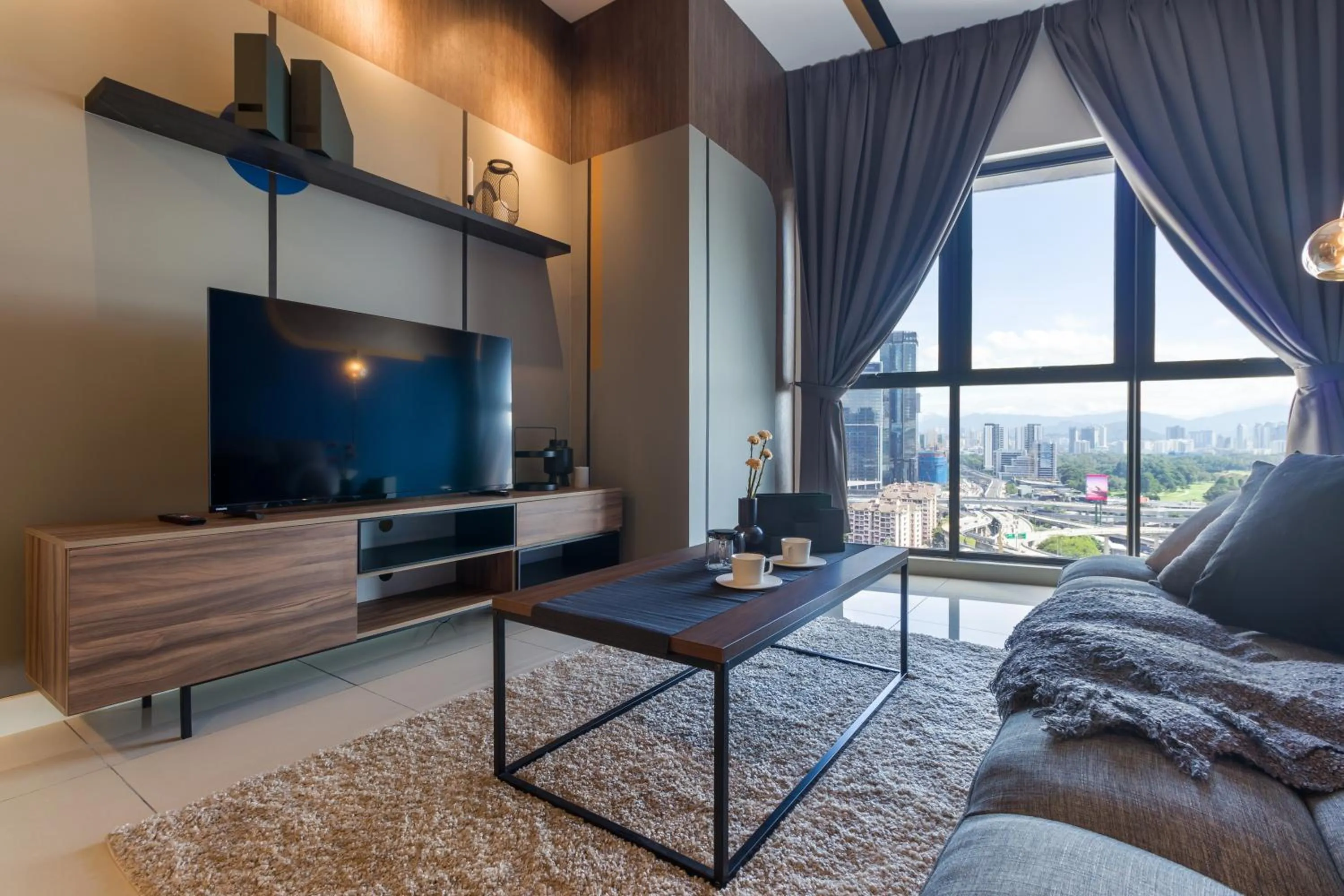 Living room in Continew Residensi by Airhost