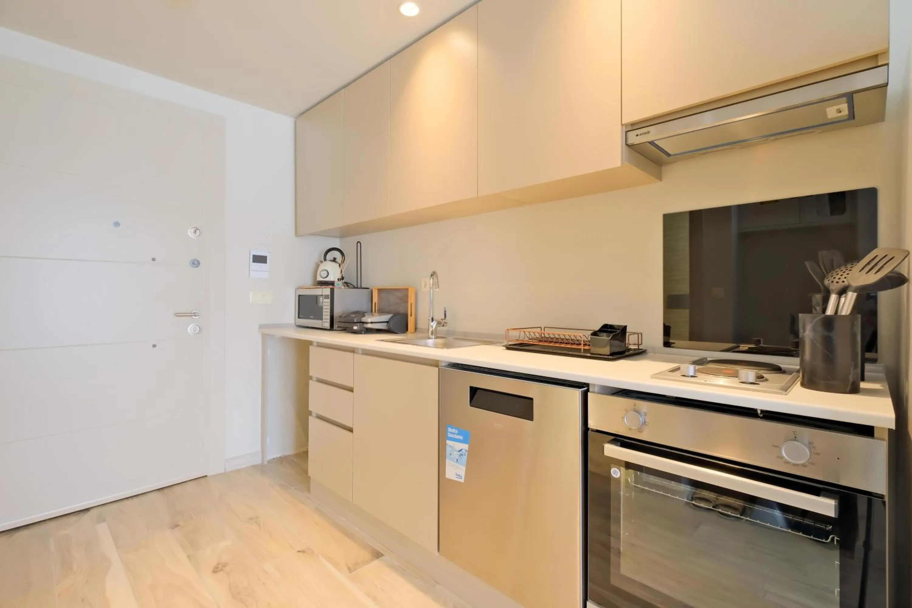 Kitchen or kitchenette in New Inn Hotel Cadde 54 Mall