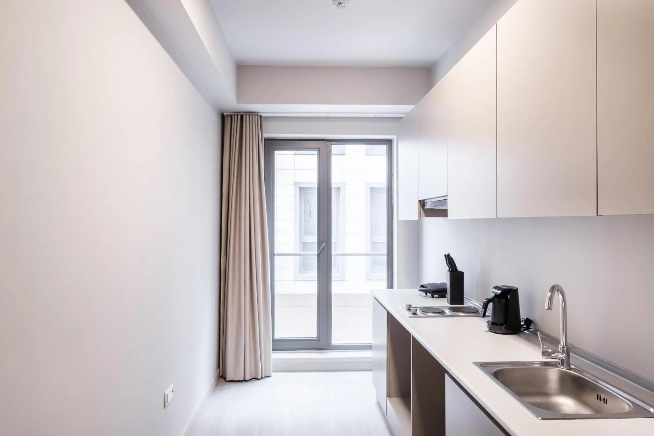 Kitchen or kitchenette in New Inn Hotel Cadde 54 Mall