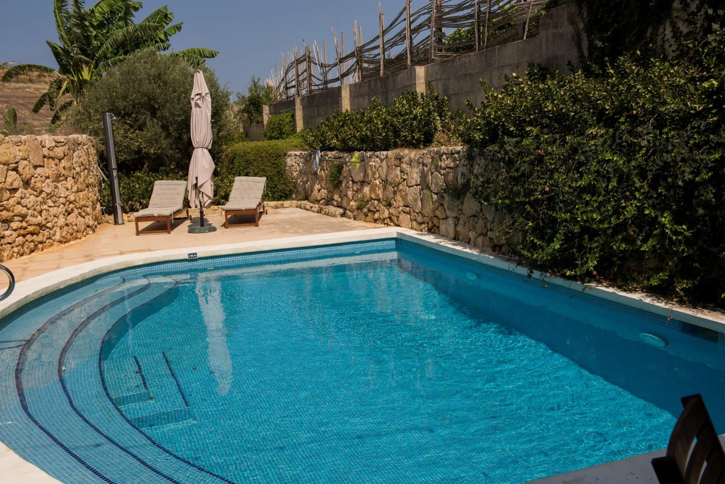Swimming pool in Farmhouse Razzett Cora