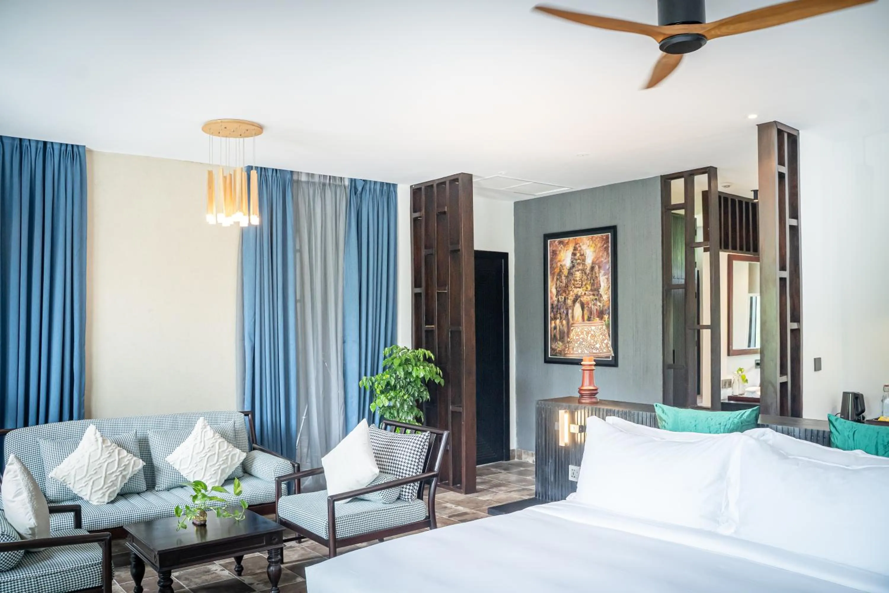 Seating area, Bed in RiverTree Villa & Resort