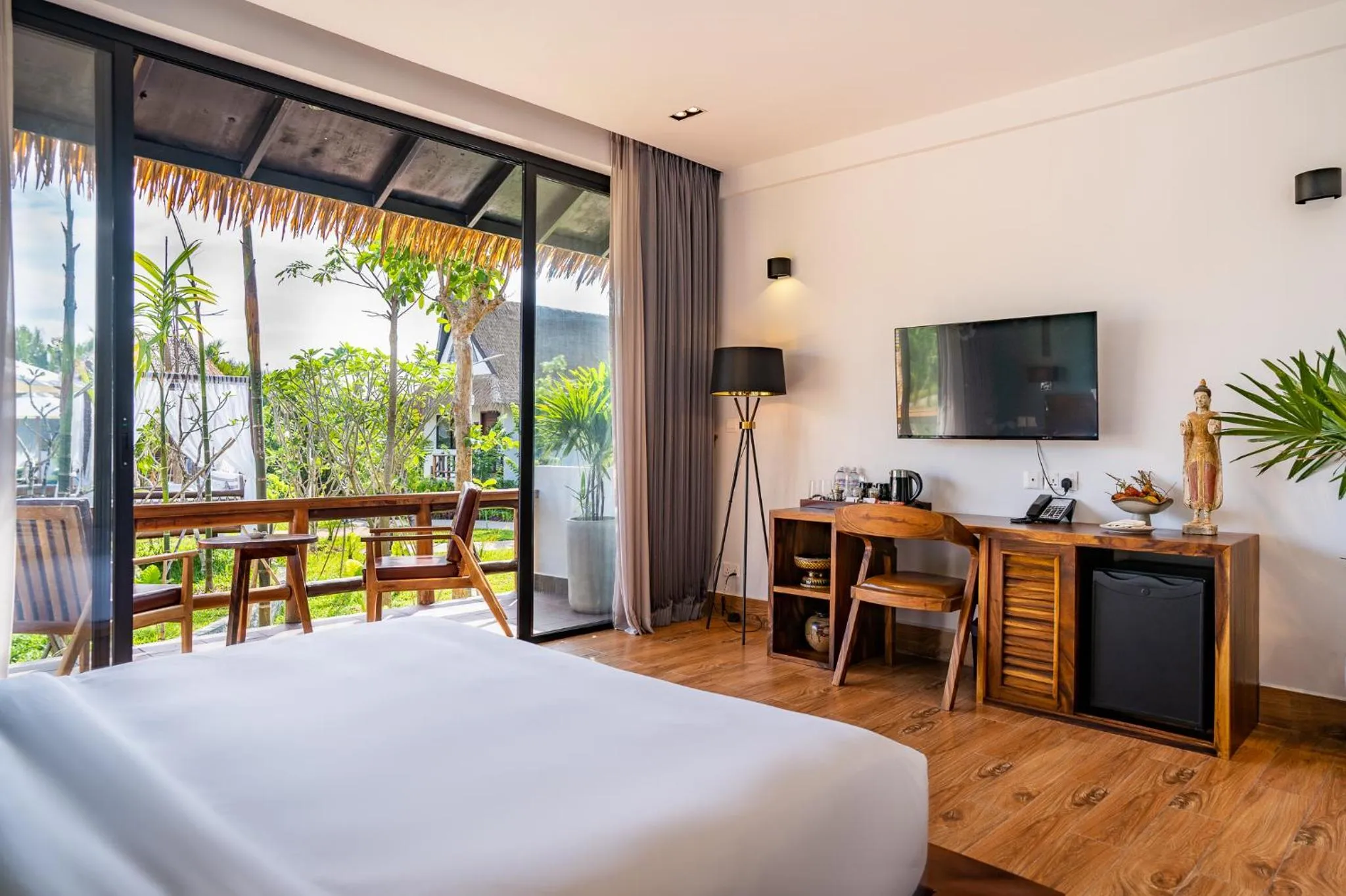 Bed in RiverTree Villa & Resort