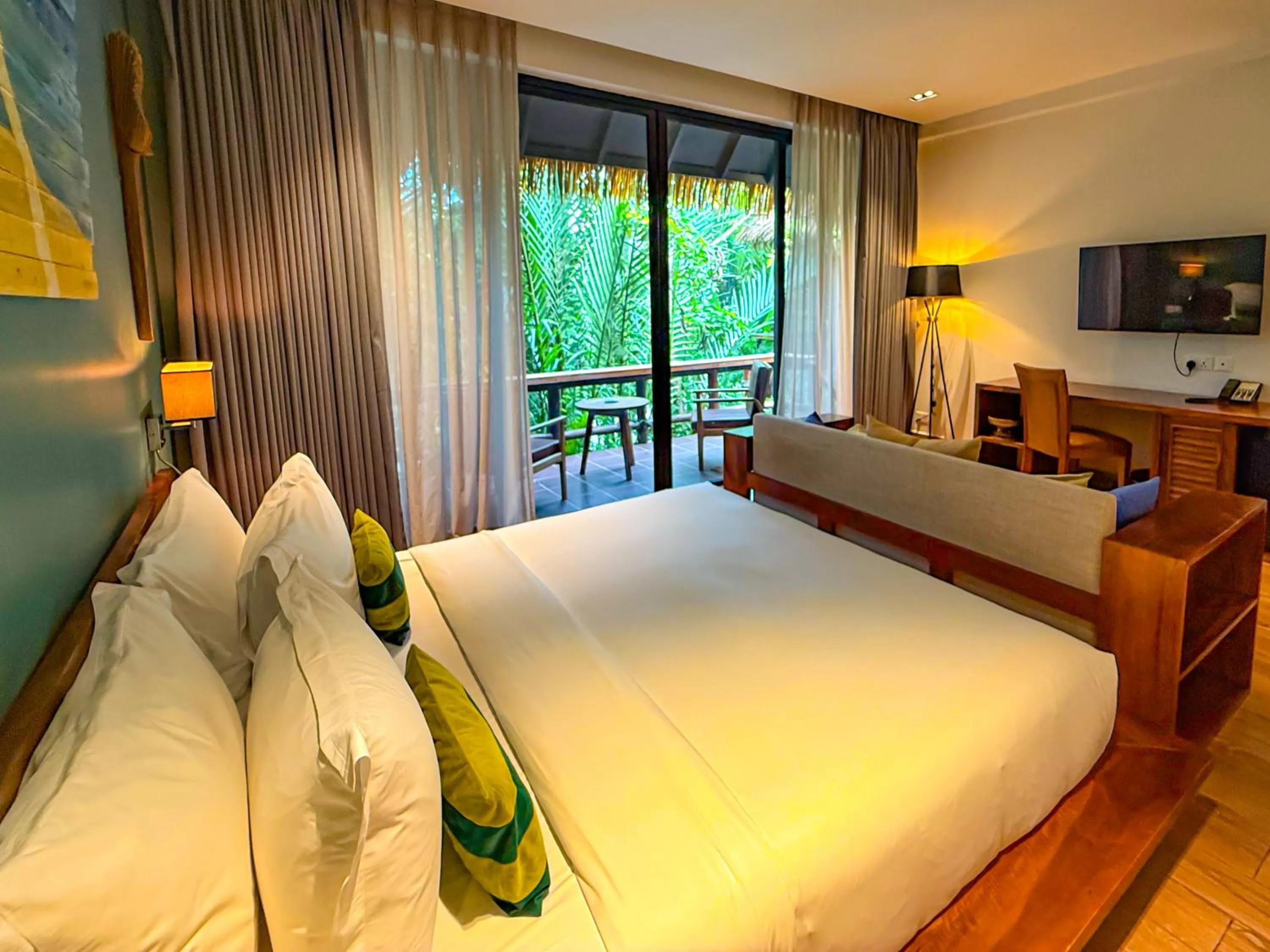 Bed in RiverTree Villa & Resort